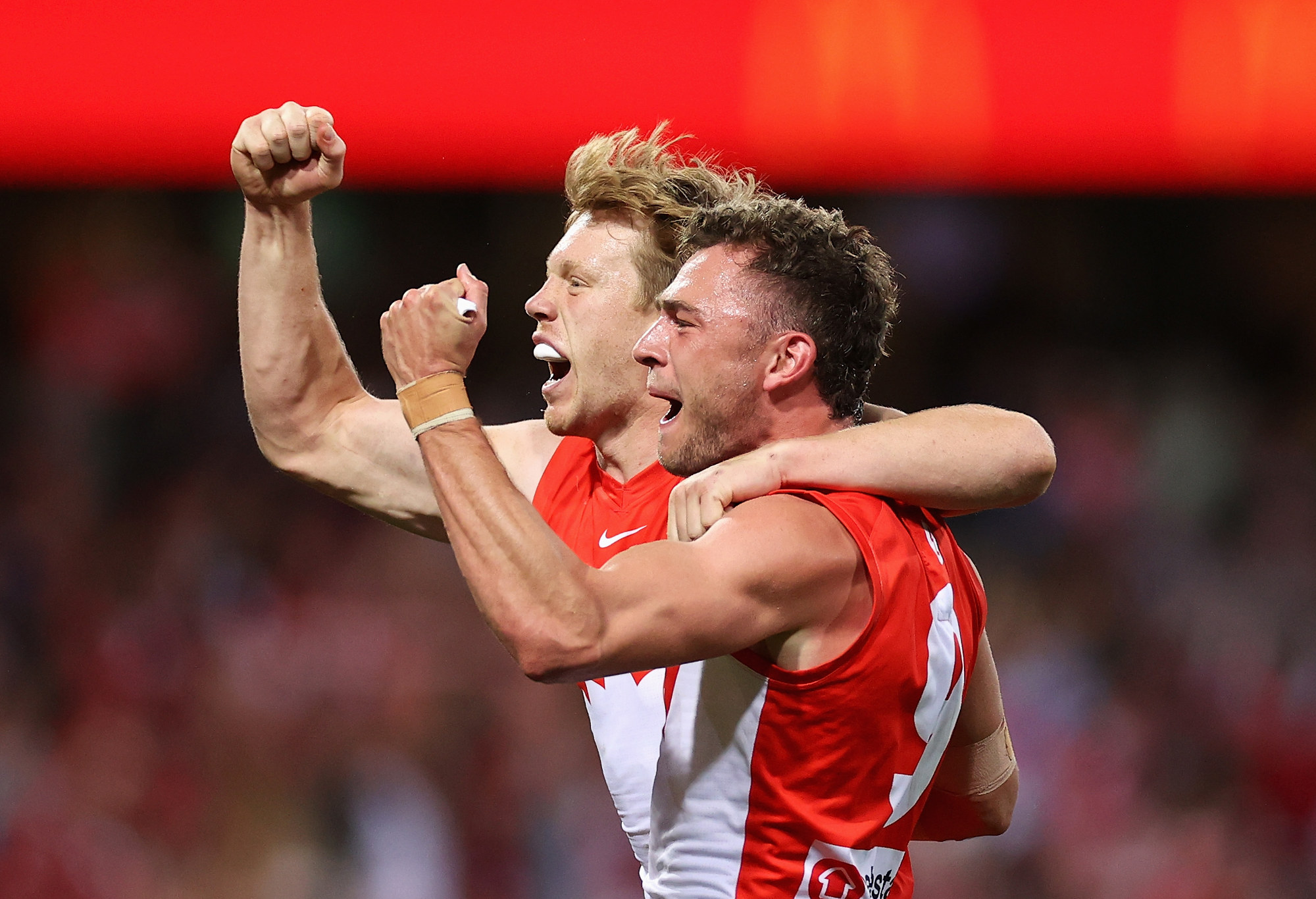 Will Hayward and Callum Mills of the Swans celebrate winning the preliminary final.