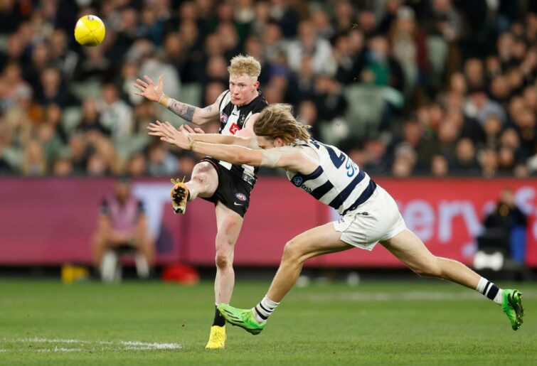 MELBOURNE, AUSTRALIA - SEPTEMBER 03: John Noble of the Magpies and Cameron Guthrie of the Cats in action during the 2022 AFL First Qualifying Final match between the Geelong Cats and the Collingwood Magpies at the Melbourne Cricket Ground on September 3, 2022 in Melbourne, Australia. (Photo by Michael Willson/AFL Photos via Getty Images)