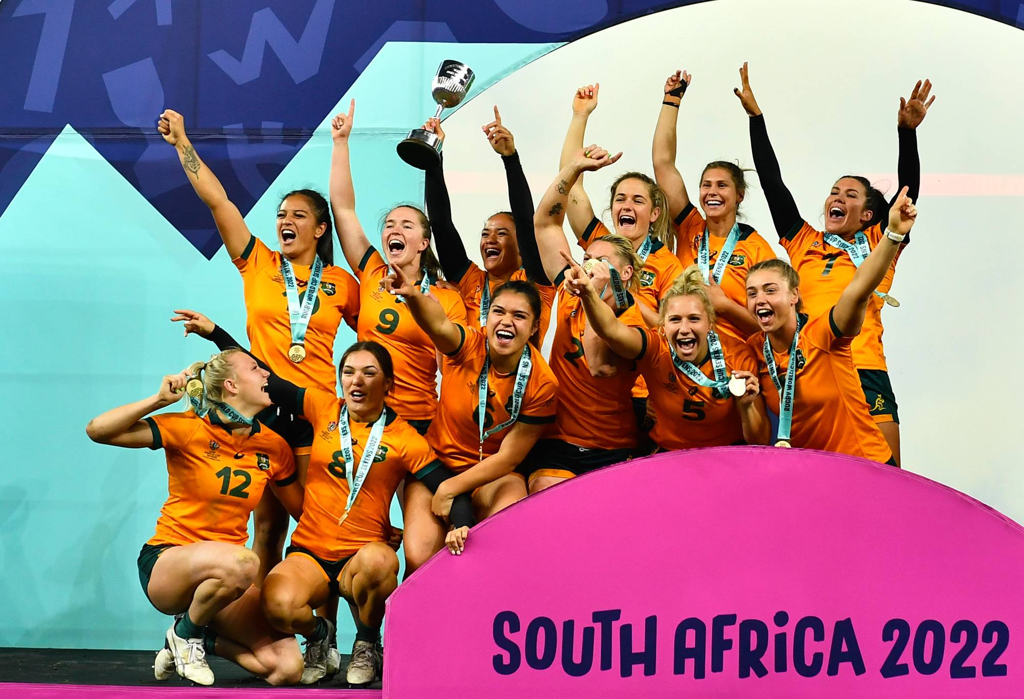 RWC Sevens winners, Australia women celebrate on the podium during day 3 of the Rugby World Cup Sevens 2022 Match 52 Championship Final between New Zealand and Fiji at DHL Stadium on September 11, 2022 in Cape Town, South Africa. (Photo by Ashley Vlotman/Gallo Images/Getty Images)