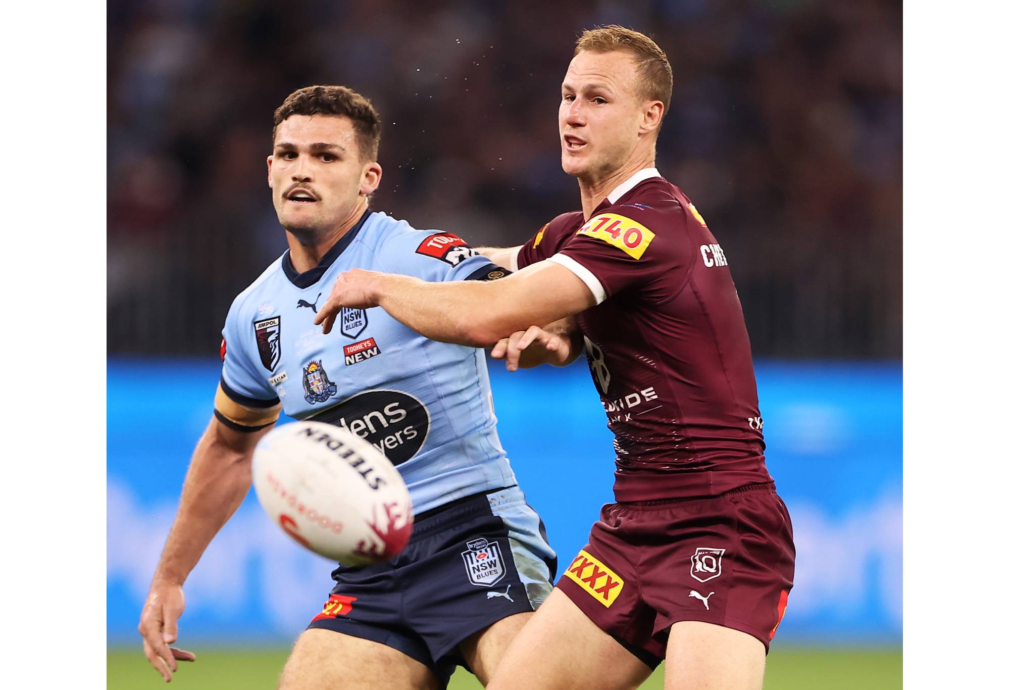 PERTH, AUSTRALIA - JUNE 26: Nathan Cleary of the Blues kicks next to Daly Cherry-Evans of the Maroons during game two of the State of Origin series between New South Wales Blues and Queensland Maroons at Optus Stadium, on June 26, 2022, in Perth, Australia. (Photo by Mark Kolbe/Getty Images)