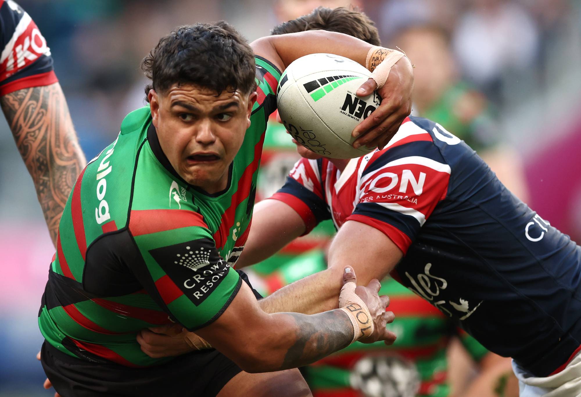 SYDNEY, AUSTRALIA - SEPTEMBER 11: Latrell Mitchell of the Rabbitohs is tackled during the NRL Elimination Final match between the Sydney Roosters and the South Sydney Rabbitohs at Allianz Stadium on September 11, 2022 in Sydney, Australia. (Photo by Matt King/Getty Images)
