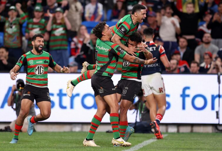 SYDNEY, AUSTRALIA - SEPTEMBER 11: Isaiah Tass of the Rabbitohs celebrates with teammates after scoring a try during the NRL Elimination Final match between the Sydney Roosters and the South Sydney Rabbitohs at Allianz Stadium on September 11, 2022 in Sydney, Australia. (Photo by Mark Kolbe/Getty Images)