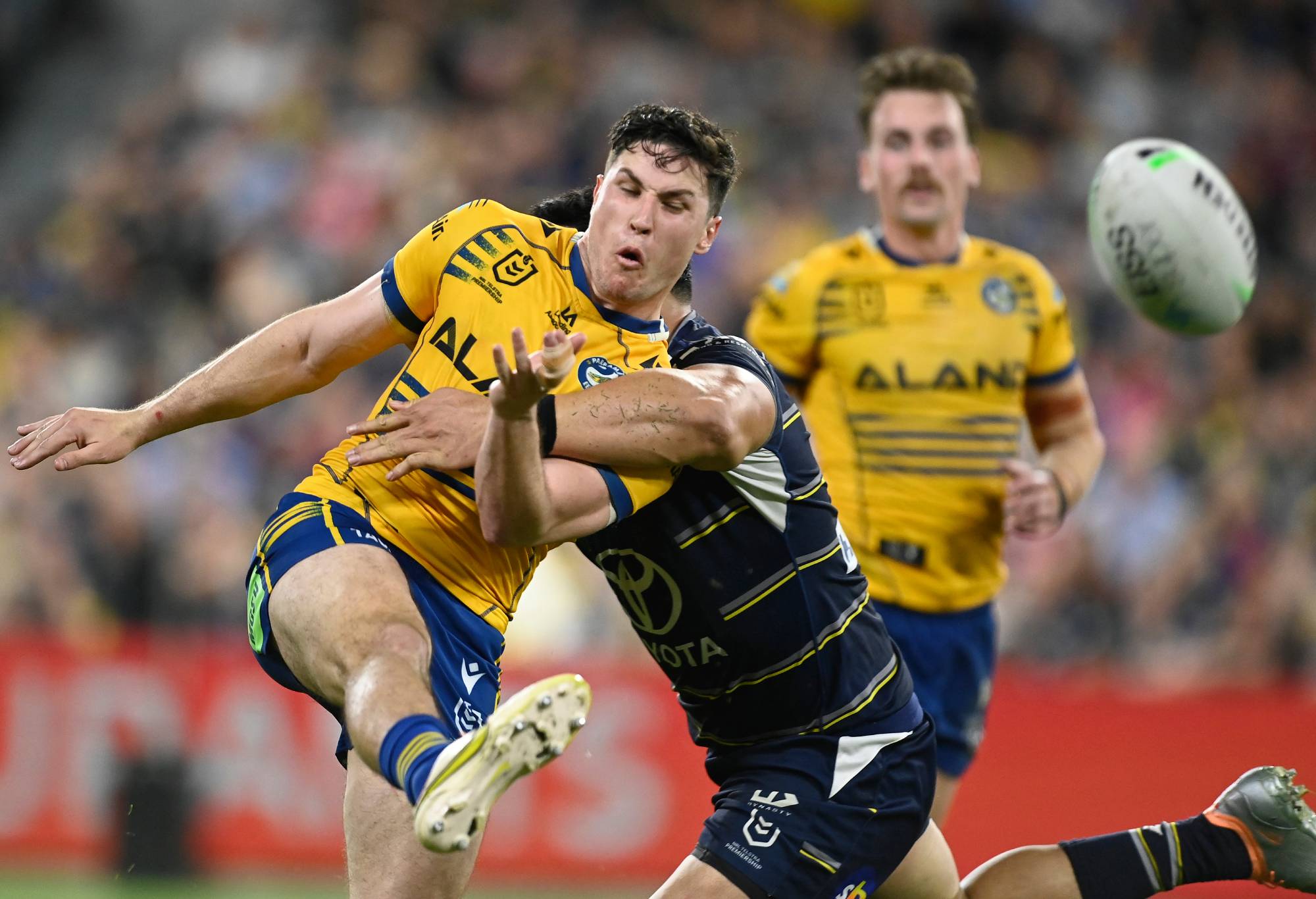 TOWNSVILLE, AUSTRALIA - SEPTEMBER 23: Mitchell Moses of the Eels kicks the ball during the NRL Preliminary Final match between the North Queensland Cowboys and the Parramatta Eels at Queensland Country Bank Stadium on September 23, 2022 in Townsville, Australia. (Photo by Ian Hitchcock/Getty Images)