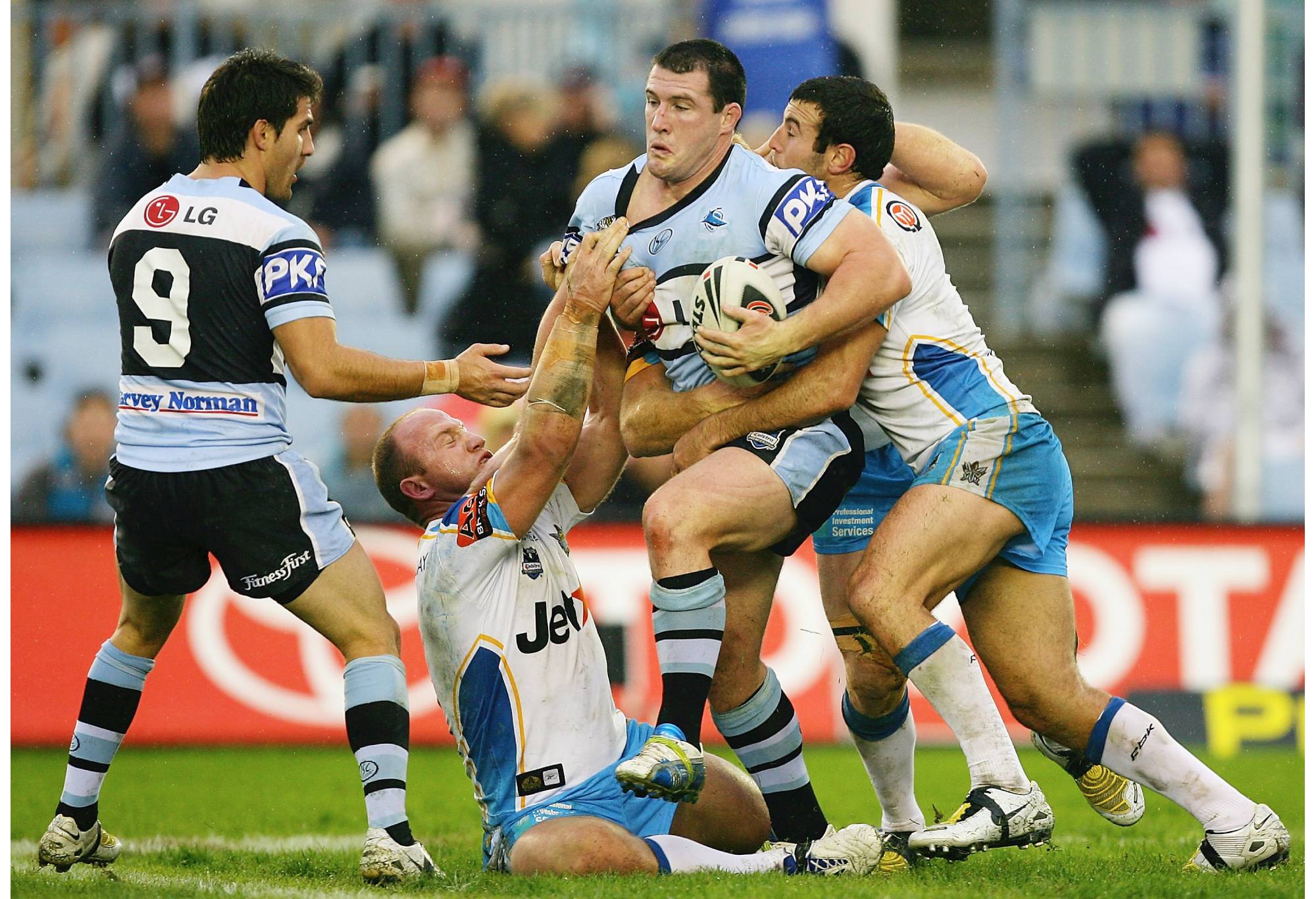 SYDNEY, AUSTRALIA - JUNE 01:  Paul Gallen of the Sharks takes on the Titans defence during the round 12 NRL match between the Cronulla Sharks and the Gold Coast Titans at Toyota Stadium on June 1, 2008 in Sydney, Australia.  (Photo by Matt King/Getty Images)