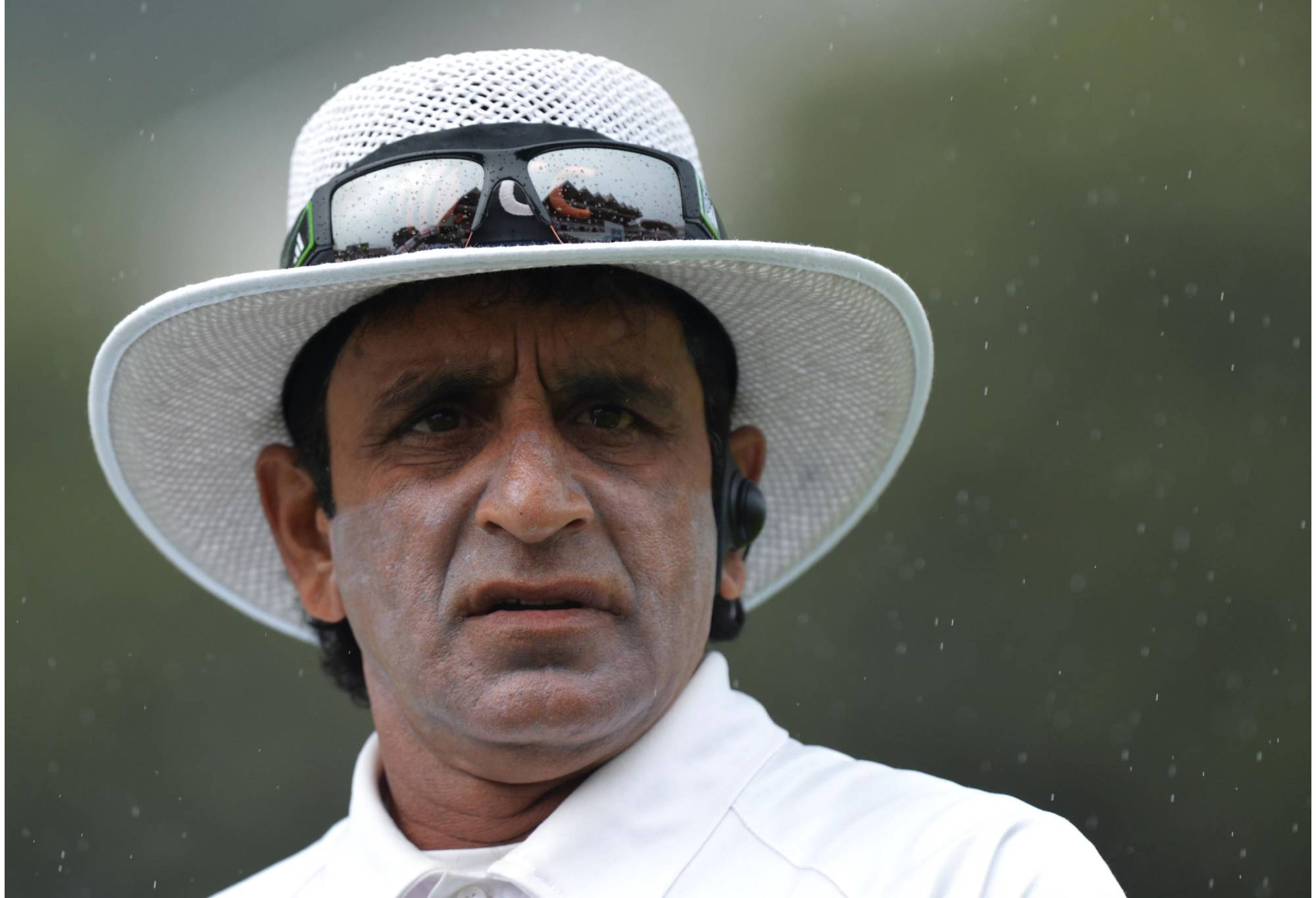 Umpire Asad Rauf looks-on as rain falls during day four of the Second Test match at Hawkins Basin Reserve, Wellington, New Zealand.   (Photo by Anthony Devlin/PA Images via Getty Images)
