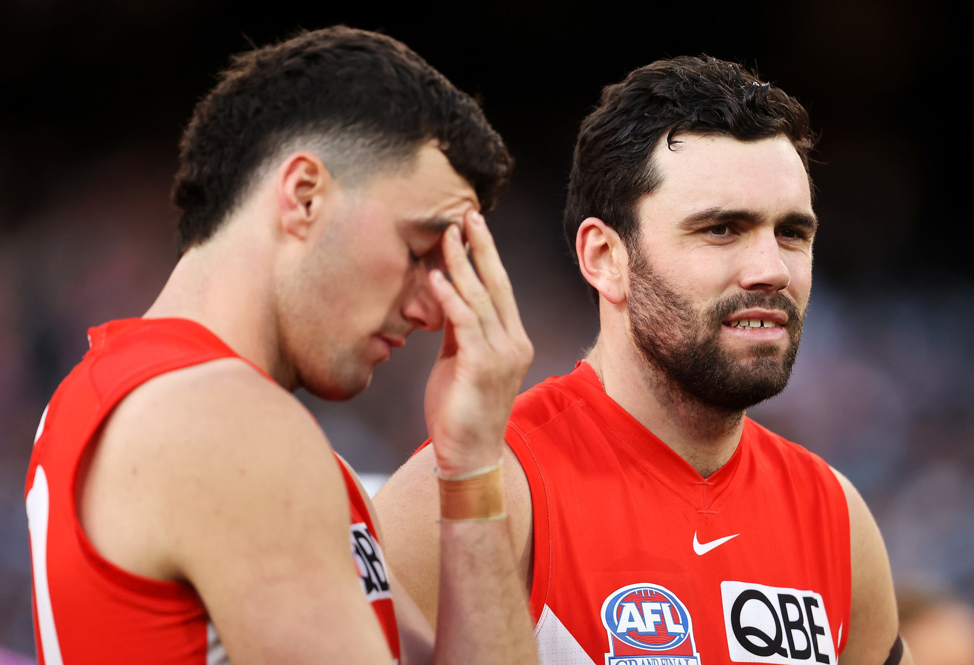 Tom McCartin and Paddy McCartin of the Swans look dejected.