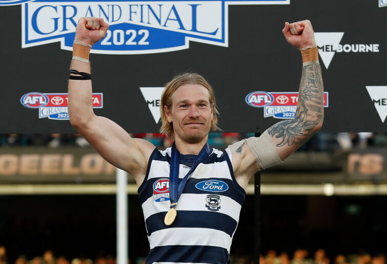 Tom Stewart of the Cats celebrates.