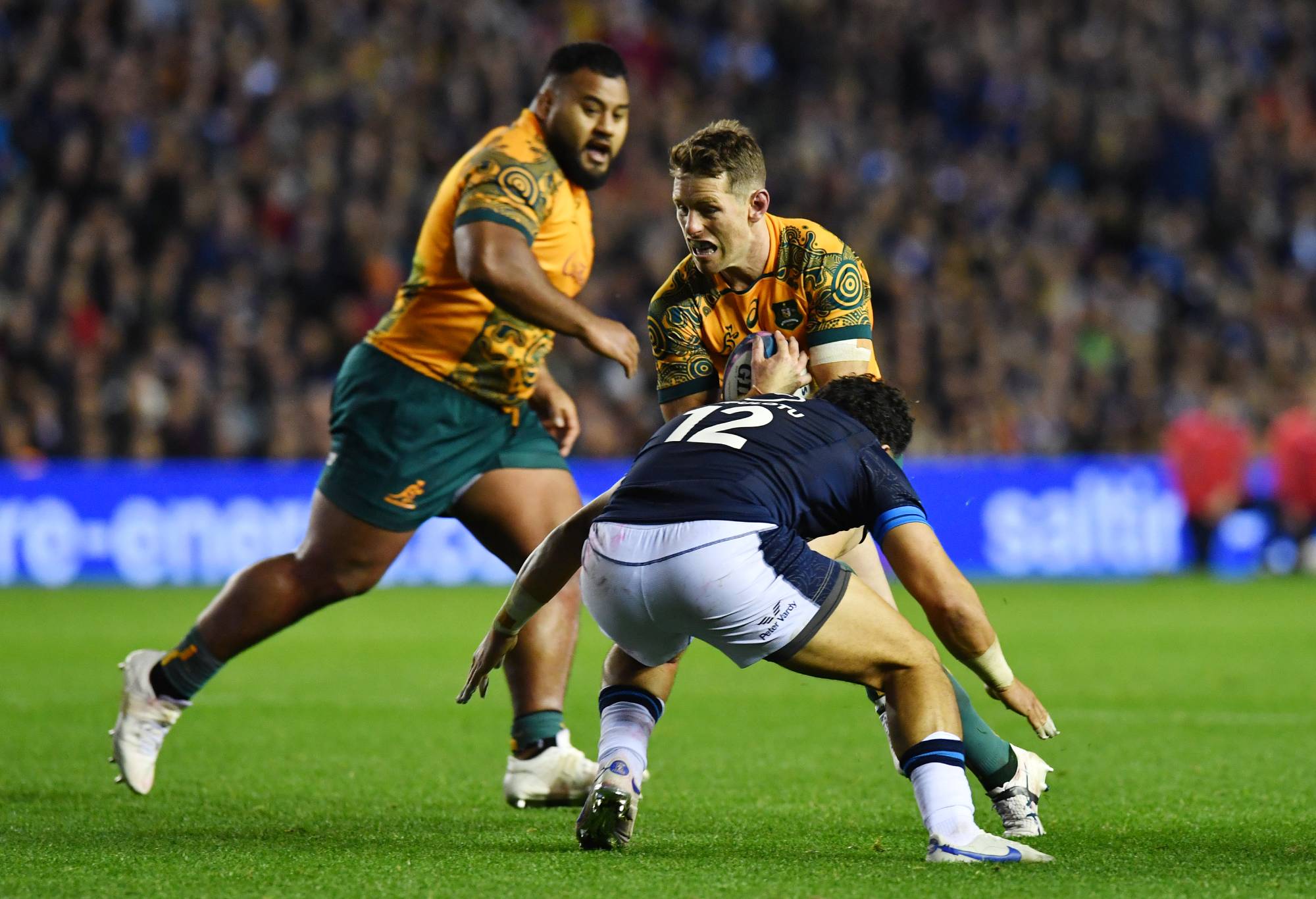 Bernard Foley of Australia is challenged by Sione Tuipulotu of Scotland during the Autumn International match between Scotland and Australia at Murrayfield Stadium on October 29, 2022 in Edinburgh, Scotland. (Photo by Mark Runnacles/Getty Images)