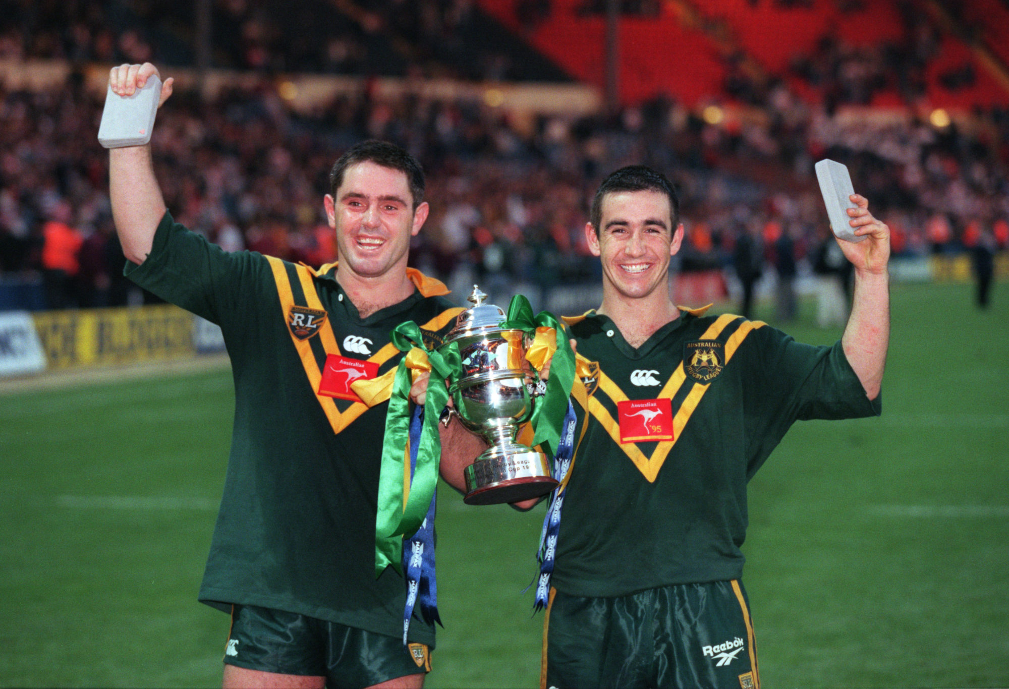 Brad Fittler and Andrew Johns of Australia hold the 1995 World Cup trophy