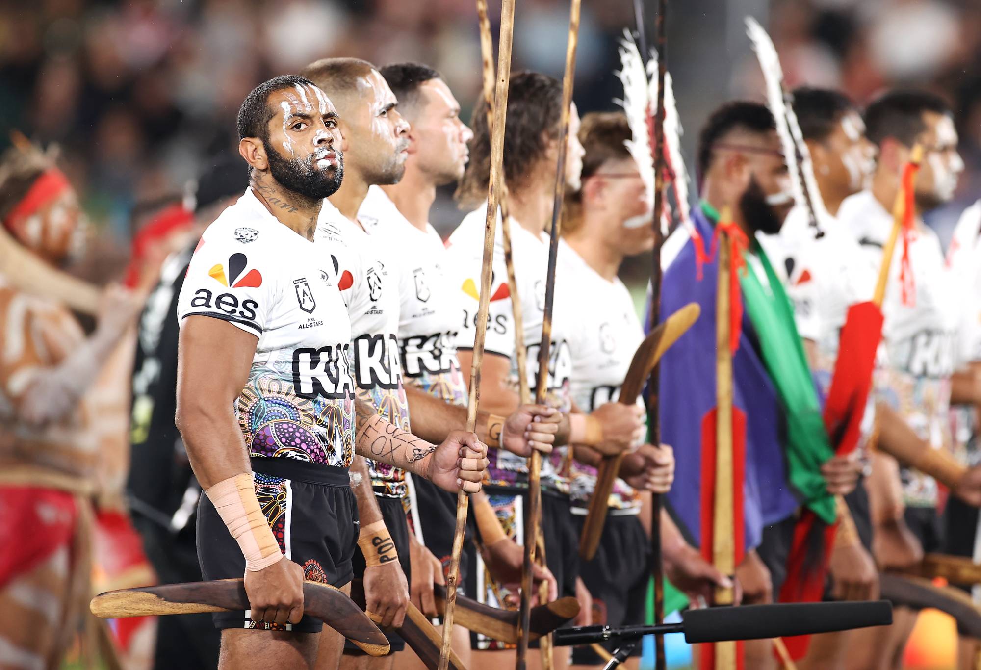 SYDNEY, AUSTRALIA - FEBRUARY 12: Josh Addo-Carr of the Indigenous All Stars waits as he and his team prepare to perform  the war cry during the pre-match ceremony before the match between the Men's Indigenous All Stars and the Men's Maori All Stars at CommBank Stadium on February 12, 2022 in Sydney, Australia. (Photo by Mark Kolbe/Getty Images)