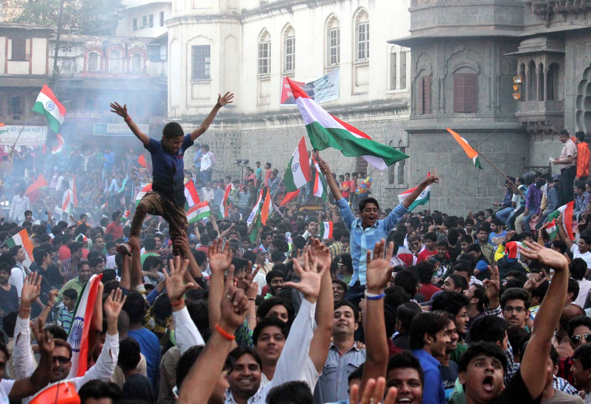 INDORE, INDIA - FEBRUARY 15: Cricket fans celebrate India's victory over Pakistan in an ICC World Cup 2015 match, on February 15, 2015 in Indore, India. Cricket fans distributed sweets and burst firecrackers, while many came out on roads and danced to the beating of drums as soon as Mohit Sharma took the last wicket of Sohail Khan to seal Pakistan's fate in Adelaide. India have won all their previous World Cup matches against Pakistan, but Pakistani media and fans were hoping against hope for a first-ever success. (Photo By Shankar Mourya/Hindustan Times via Getty Images)