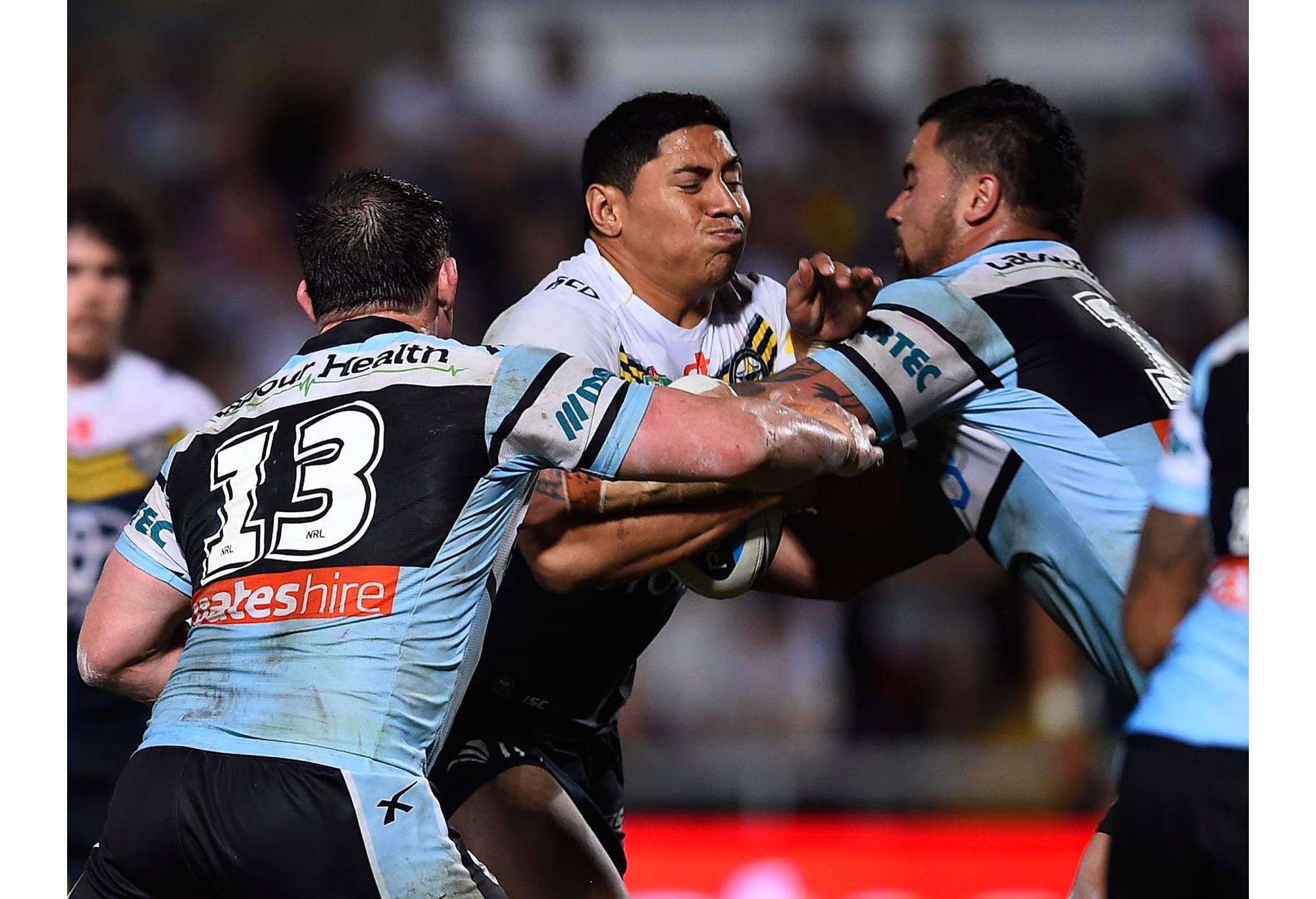 TOWNSVILLE, AUSTRALIA - SEPTEMBER 19: Jason Taumalolo of the Cowboys is tackled by Paul Gallen of the Sharks during the Second NRL Semi Final match between the North Queensland Cowboys and the Cronulla Sharks at 1300SMILES Stadium on September 19, 2015 in Townsville, Australia. (Photo by Ian Hitchcock/Getty Images)