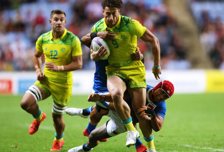 Mark Nawaqanitawase of Team Australiais tackled by Melani Matavao of Team Samoa during the Men's Rugby Sevens Quarter Final match between Team Australia and Team Samoa on day two of the Birmingham 2022 Commonwealth Games at Coventry Stadium on July 30, 2022 on the Coventry, England. (Photo by Richard Heathcote/Getty Images)