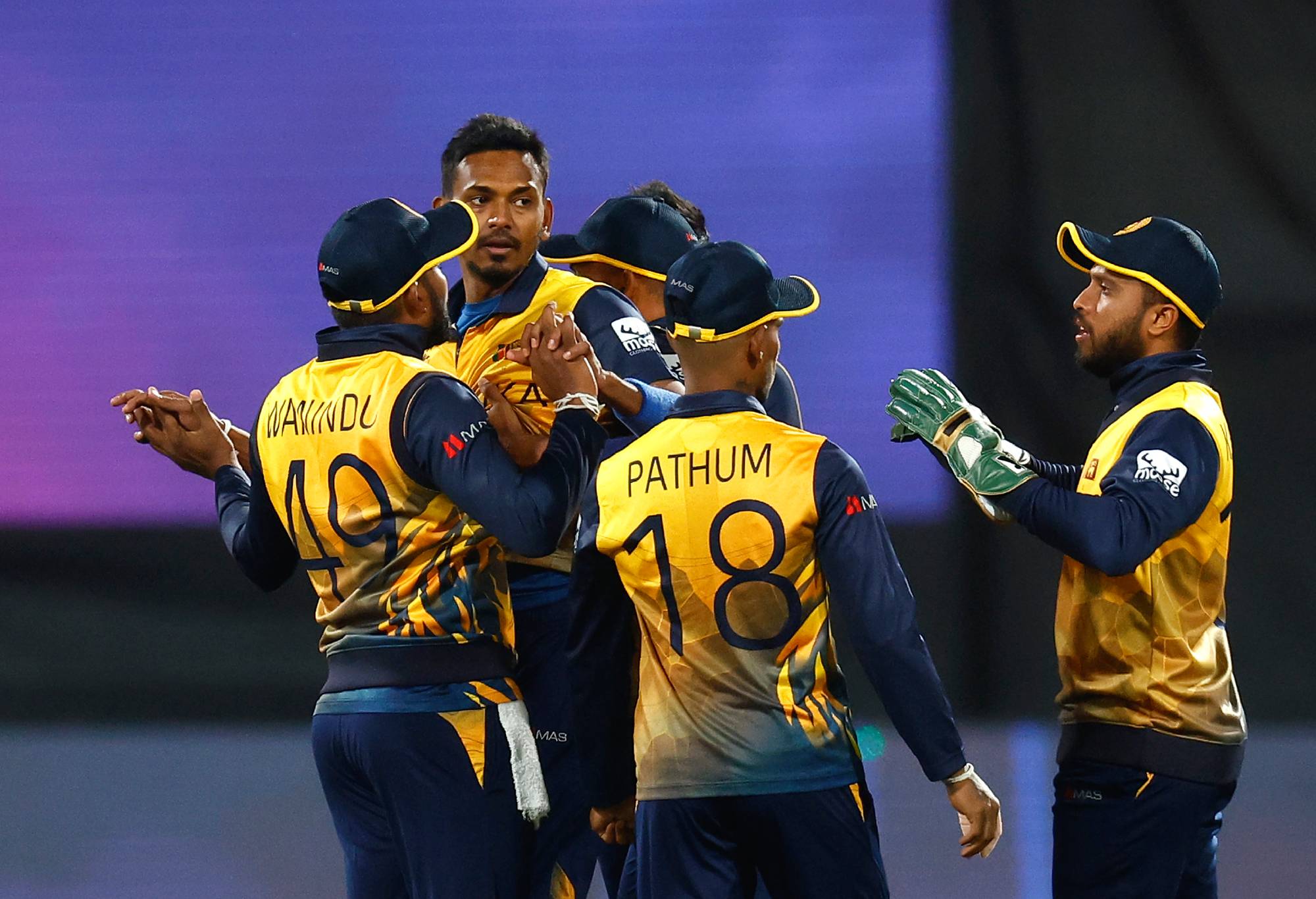 Dushmantha Chameera of Sri Lanka celebrates with team mates after taking the wicket of Muhammad Waseem of the United Arab Emirates for 2 runs during the ICC Men's T20 World Cup match between Sri Lanka and UAE at GMHBA Stadium on October 18, 2022 in Geelong, Australia. (Photo by Daniel Pockett-ICC/ICC via Getty Images)