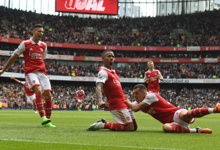 (2ndL) Gabriel Jesus celebrates scoring the 2nd Arsenal goal with (L) Gabriel Martinelli and (R) Granit Xhaka during the Premier League match between Arsenal FC and Tottenham Hotspur at Emirates Stadium on October 01, 2022 in London, England. (Photo by Stuart MacFarlane/Arsenal FC via Getty Images)