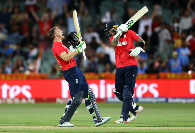 Jos Buttler and Alex Hales of England celebrate victory.