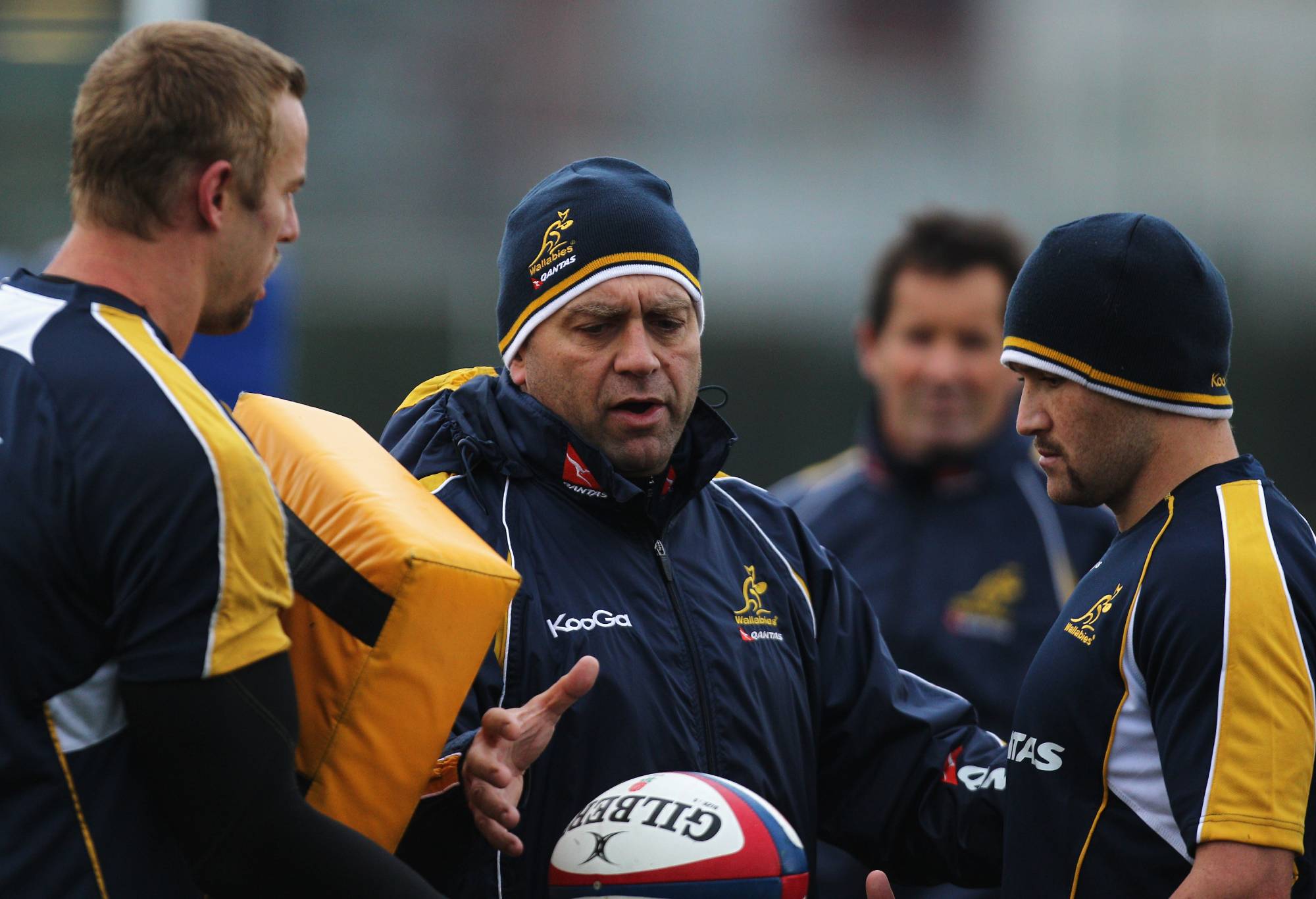 Assistant Coach, David Nucifora speaks to Mark Chisholm (L) and Matt Giteau (R) during an Australian Wallabies training session at Latymer Upper School on November 9, 2010 in London, England. (Photo by Dean Mouhtaropoulos/Getty Images)