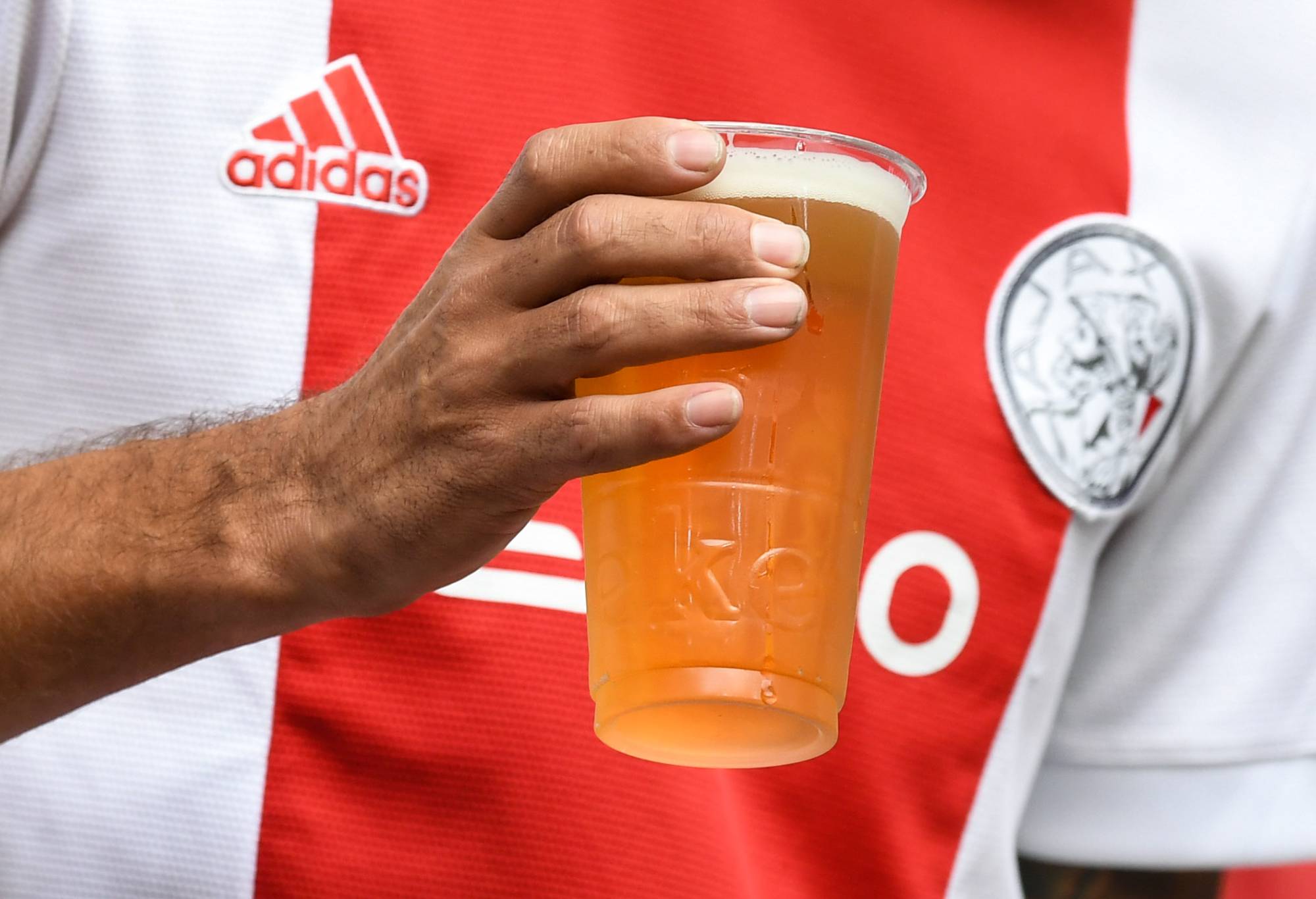 AMSTERDAM, NETHERLANDS - SEPTEMBER 07: An Ajax fan with a pint of beer during a UEFA Champions League match between Ajax and Rangers at the Johan Cruyff Arena, on September 07, 2022, in Amsterdam, Netherlands. (Photo by Craig Foy/SNS Group via Getty Images)
