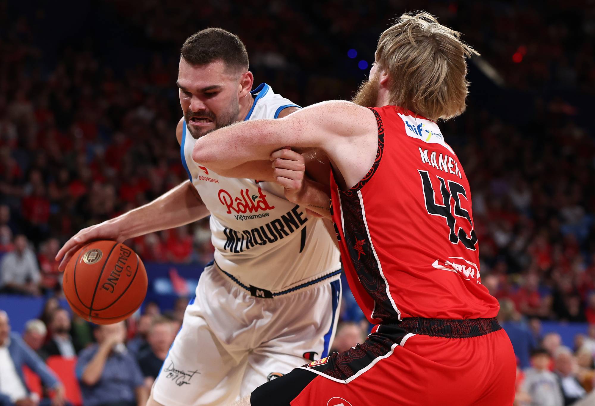 PERTH, AUSTRALIA - OCTOBER 14: Isaac Humphries of Melbourne United works to the basket against Brady Manek of the Wildcats during the round three NBL match between the Perth Wildcats and Melbourne United at RAC Arena, on October 14, 2022, in Perth, Australia. (Photo by Paul Kane/Getty Images)