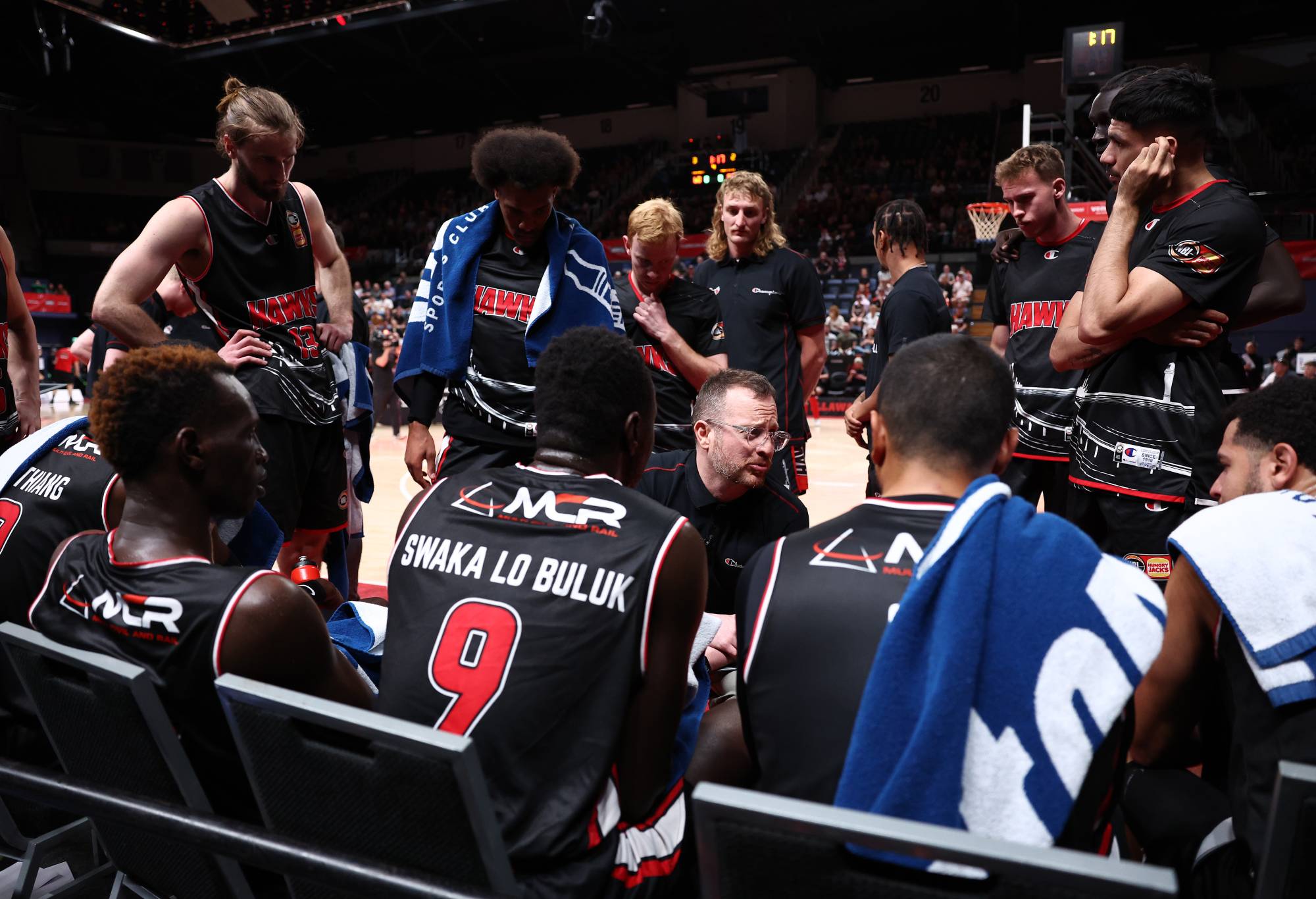 WOLLONGONG, AUSTRALIA - OCTOBER 29: Hawks coach Jacob Jackomas talks to players during the round five NBL match between Illawarra Hawks and Melbourne United at WIN Entertainment Centre, on October 29, 2022, in Wollongong, Australia. (Photo by Mark Metcalfe/Getty Images)