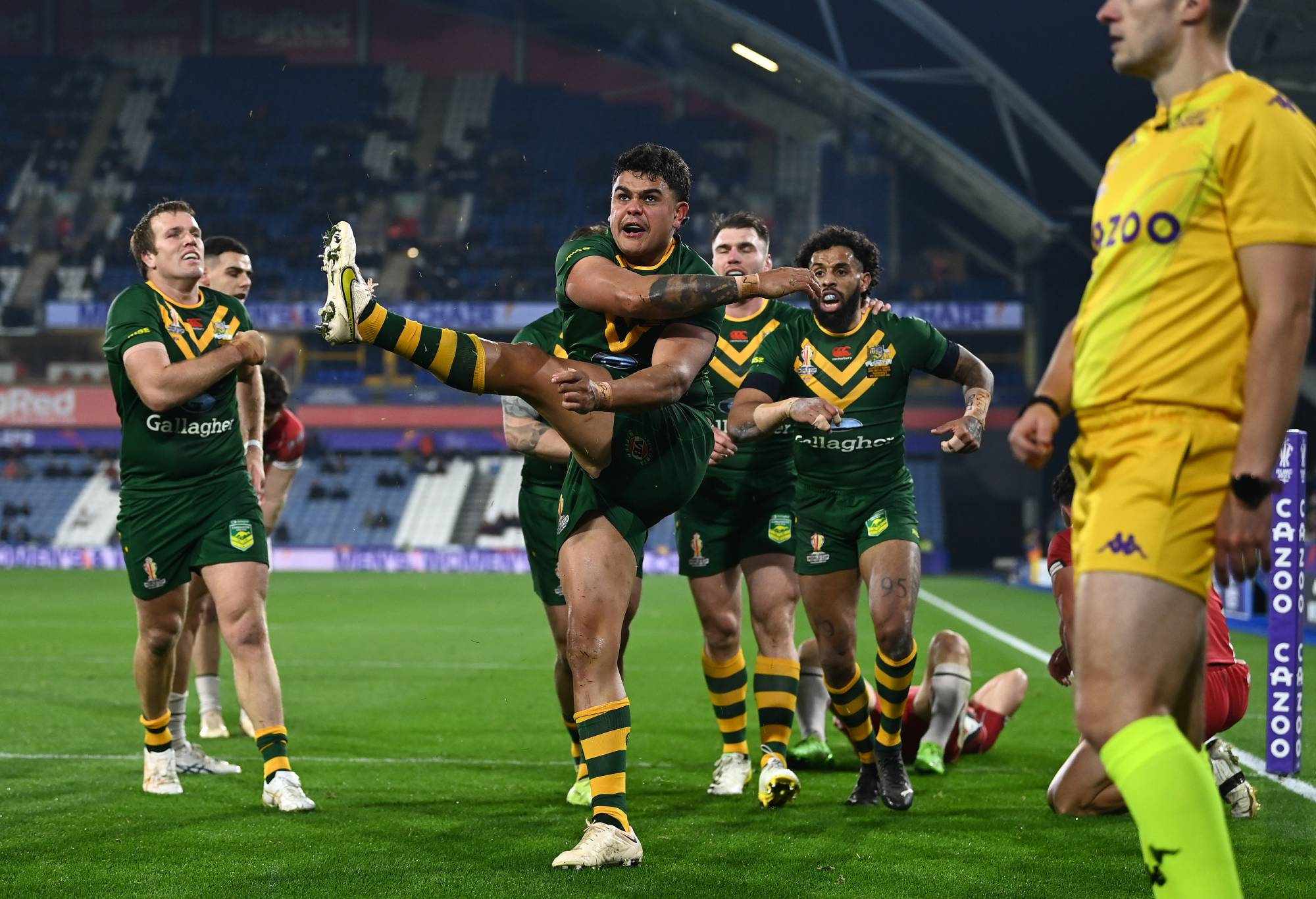 HUDDERSFIELD, ENGLAND - NOVEMBER 04: Latrell Mitchell of Australia celebrates after scoring their team's fourth try during the Rugby League World Cup Quarter Final match between Australia and Lebanon at John Smith's Stadium on November 04, 2022 in Huddersfield, England. (Photo by Gareth Copley/Getty Images)