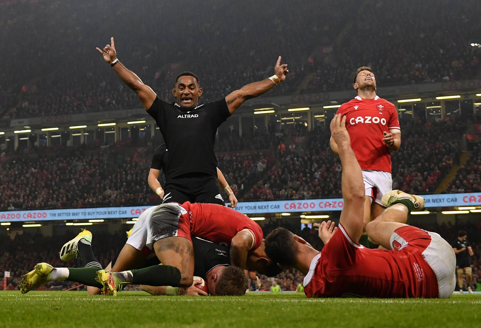 New Zealand's Caleb Clark celebrates scoring New Zealand's Jordie Barrett's third try during the Autumn International match between Wales and the New Zealand All Blacks at Principality Stadium, Cardiff, Wales on November 05, 2022.  (Photo by Dan Mullan/Getty Images)