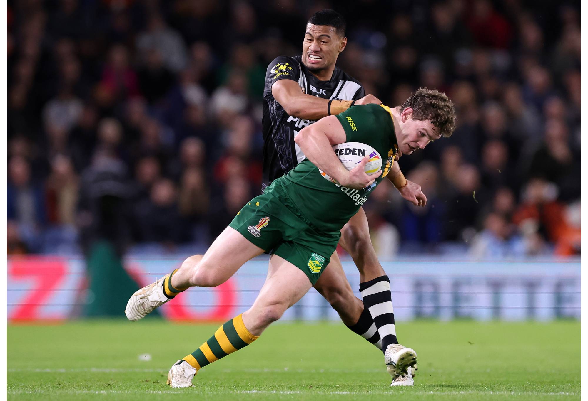 LEEDS, ENGLAND - NOVEMBER 11: Liam Martin of Australia is tackled by Ronaldo Mulitalo of New Zealand during the Rugby League World Cup Semi-Final match between Australia and New Zealand at Elland Road on November 11, 2022 in Leeds, England. (Photo by Alex Livesey/Getty Images for RLWC)