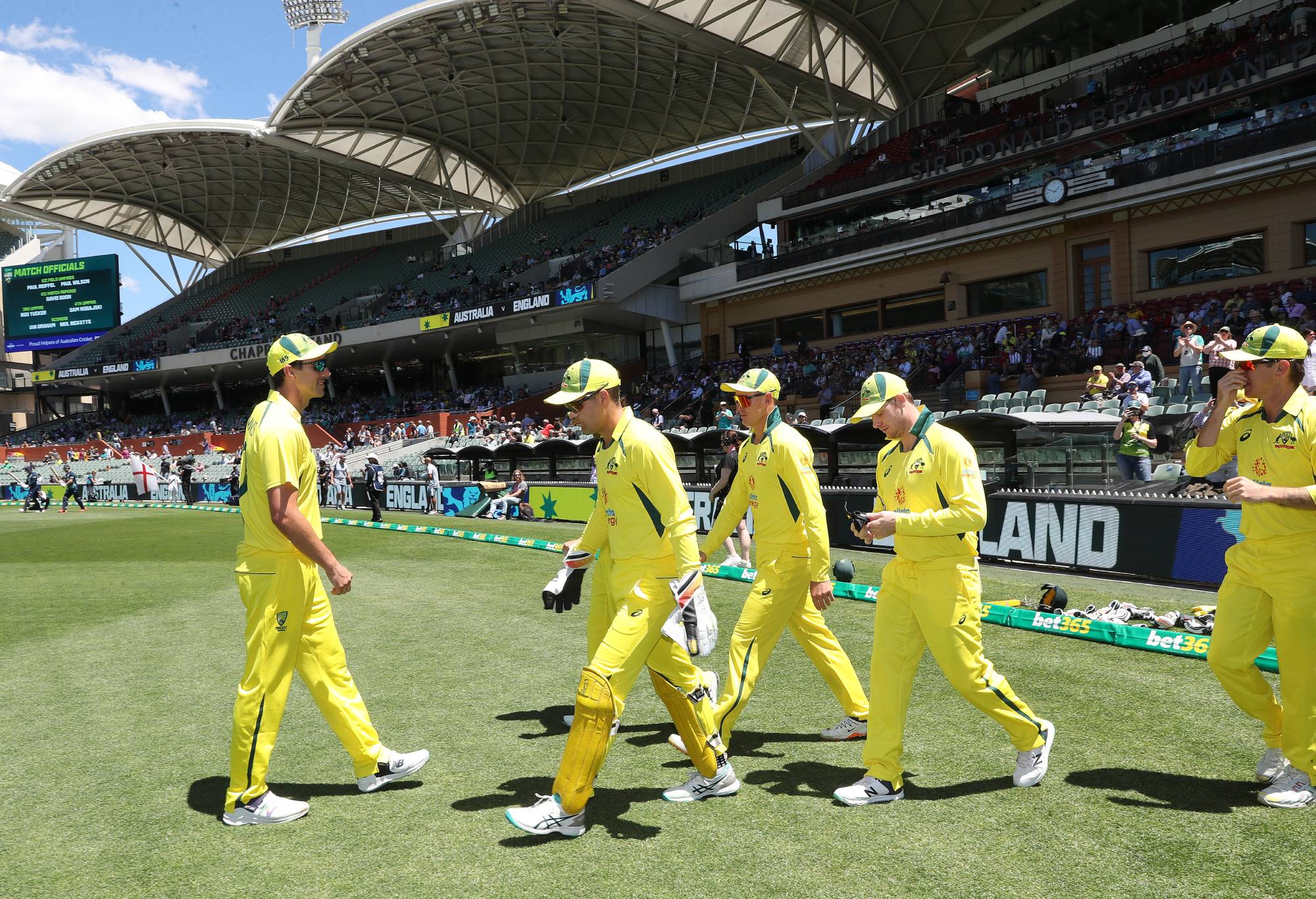 ADELAIDE, AUSTRALIA - NOVEMBER 17:  Patrick Cummins of Australia leads Australia out during game one of the One Day International series between Australia and England at Adelaide Oval on November 17, 2022 in Adelaide, Australia. (Photo by Sarah Reed/Getty Images)