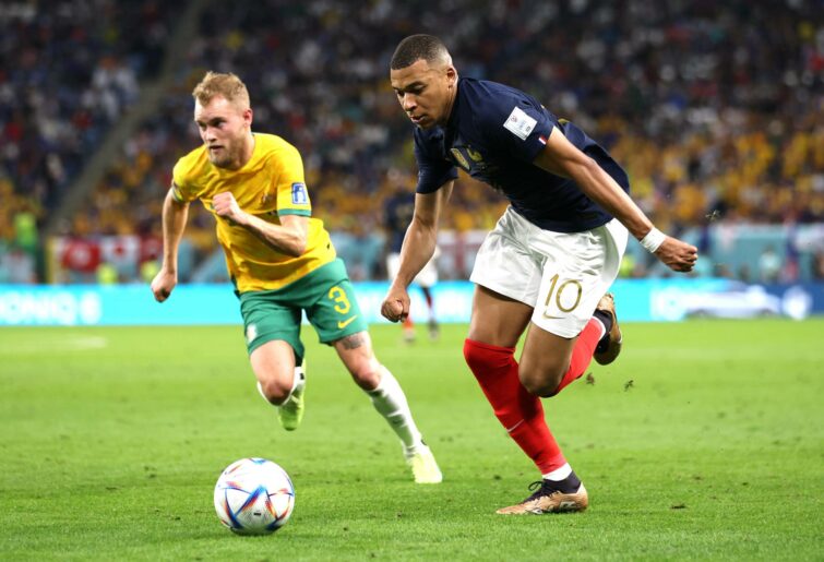 Kylian Mbappe of France controls the ball against Nathaniel Atkinson of Australia during the FIFA World Cup Qatar 2022 Group D match between France and Australia at Al Janoub Stadium on November 22, 2022 in Al Wakrah, Qatar. (Photo by Patrick Smith - FIFA/FIFA via Getty Images)