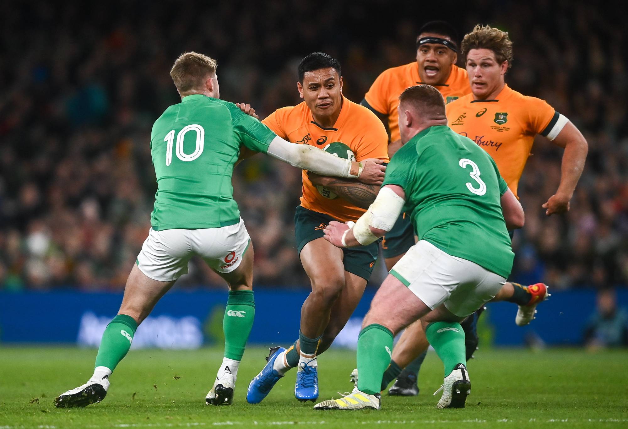 Len Ikitau of Australia is tackled by Jack Crowley, left, and Tadhg Furlong of Ireland during the Bank of Ireland Nations Series match between Ireland and Australia at the Aviva Stadium in Dublin. (Photo By David Fitzgerald/Sportsfile via Getty Images)
