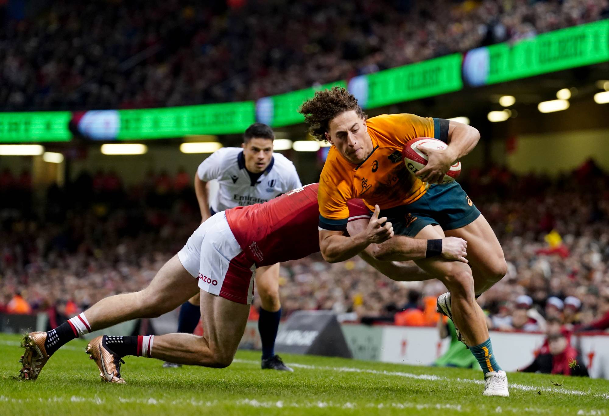 Australia's Mark Nawaqanitawase evades a tackle from Wales' Alex Cuthbert as he runs in to score a try during the Autumn International match at Principality Stadium, Cardiff. Picture date: Saturday November 26, 2022. (Photo by David Davies/PA Images via Getty Images)