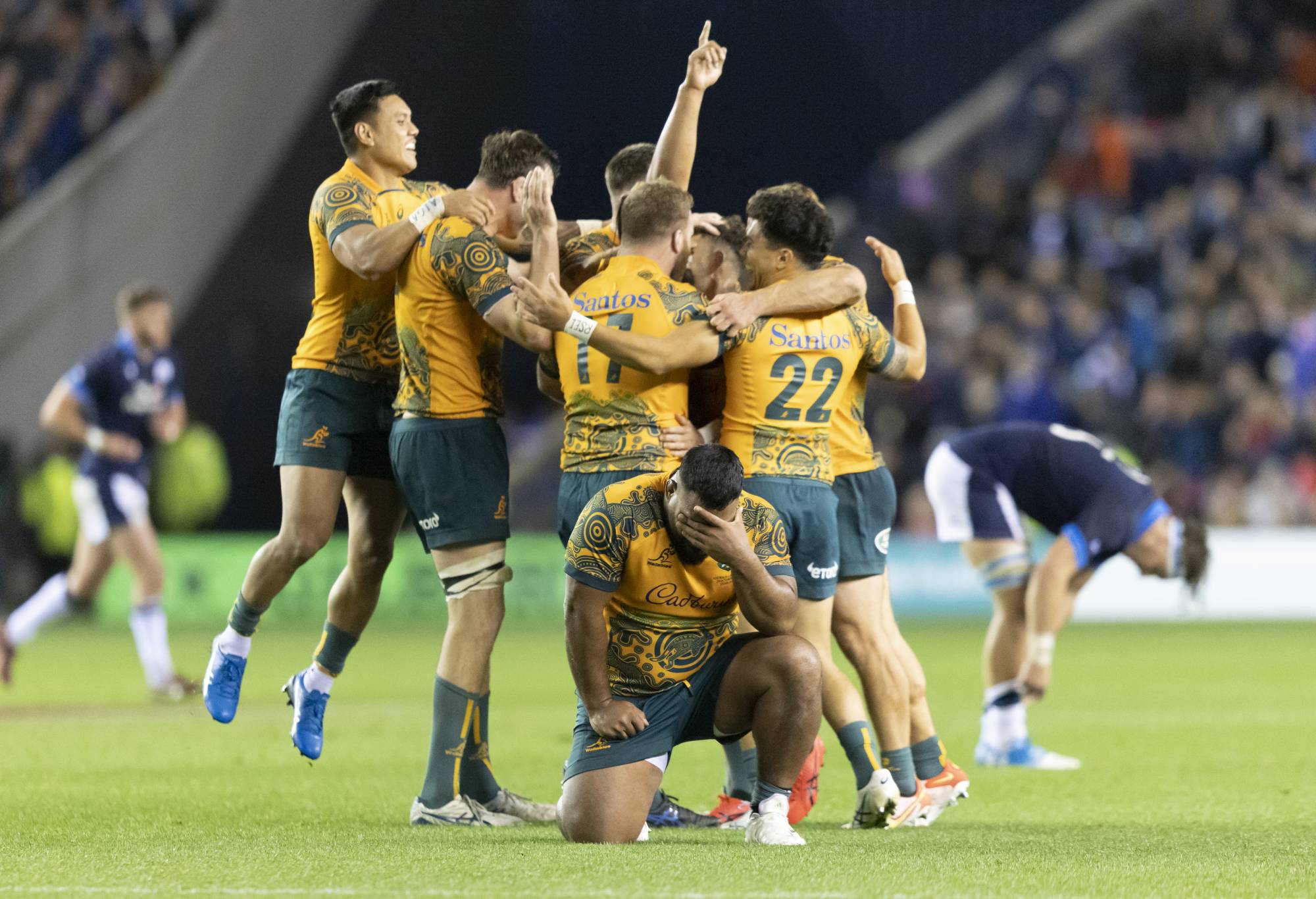 Australia's Taniela Tupou (centre kneeling) reacts as his team celebrate after winning the Autumn International match at BT Murrayfield Stadium, Edinburgh. Picture date: Saturday October 29, 2022. (Photo by Robert Perry/PA Images via Getty Images)