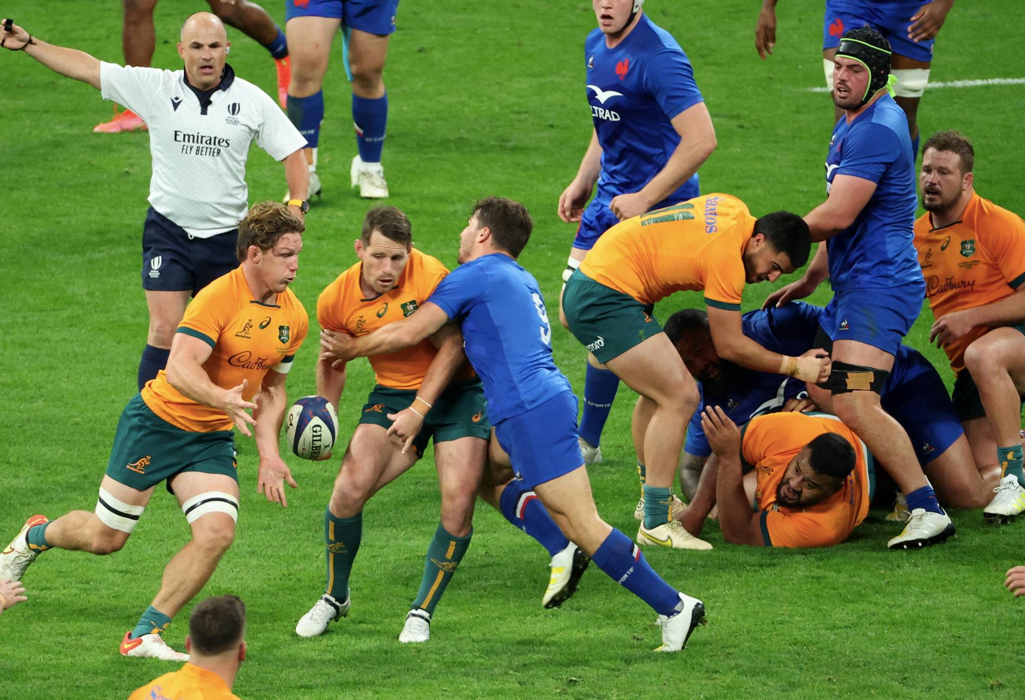 Michael Hooper #7 and Bernard Foley #10 of Team Australia in action with Antoine Dupont #9 of Team rance during the Autumn Tour match between France and Australia at Stade de France on November 05, 2022 in Paris, France. (Photo by Xavier Laine/Getty Images)