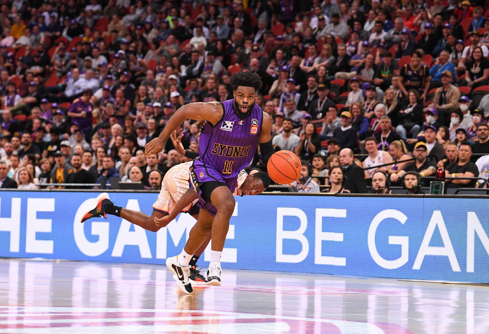 SYDNEY, AUSTRALIA - OCTOBER 14: Derrick Walton dribbles past a defender during the round three NBL match between Sydney Kings and Cairns Taipans at Qudos Bank Arena, on October 14, 2022, in Sydney, Australia. (Photo by Nathan Hopkins/Getty Images)