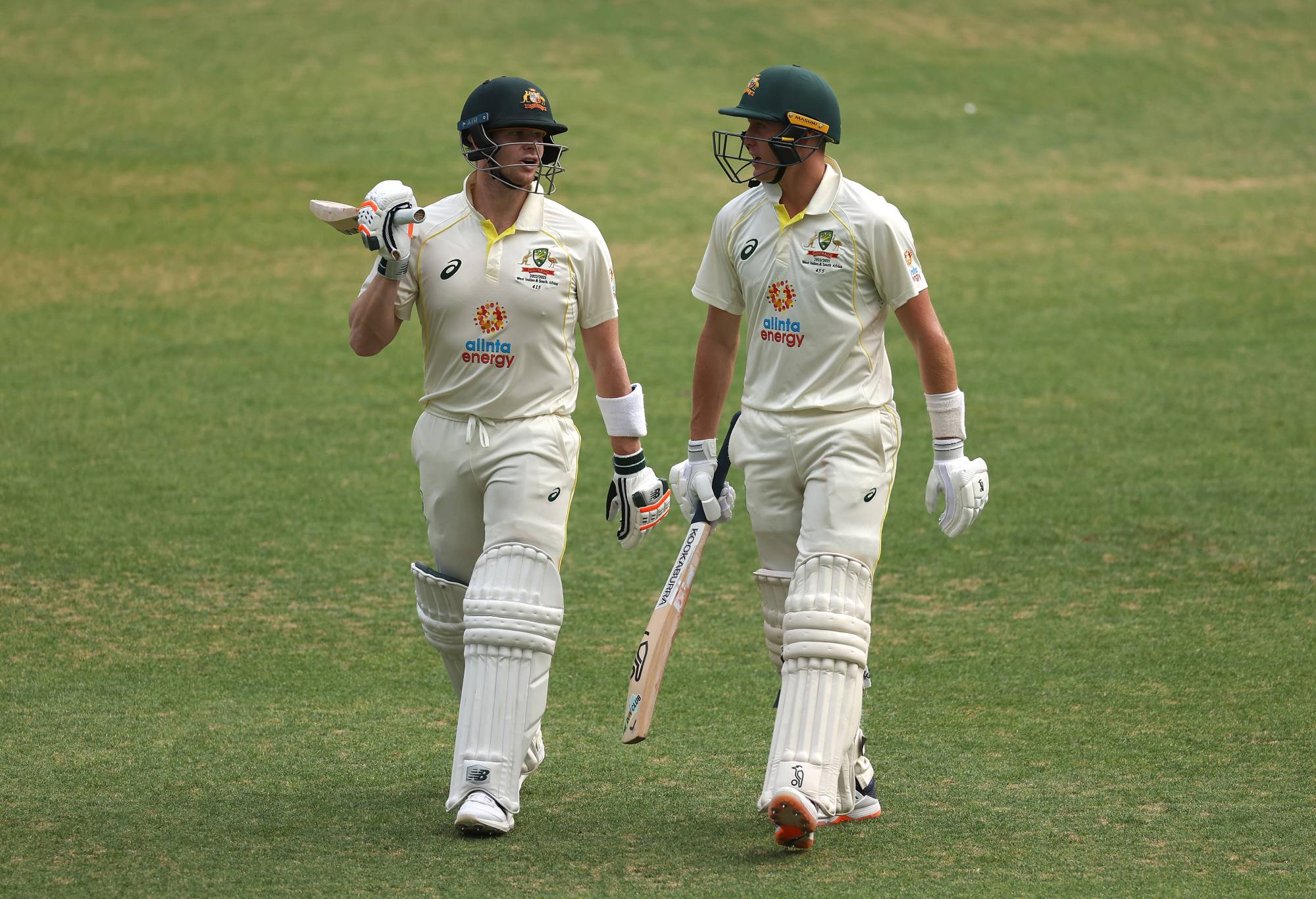 PERTH, AUSTRALIA - NOVEMBER 30: Marnus Labuschagne (R) and Steve Smith of Australia walk off the field after day one of the First Test match between Australia and the West Indies at Optus Stadium on November 30, 2022 in Perth, Australia. (Photo by Cameron Spencer/Getty Images)