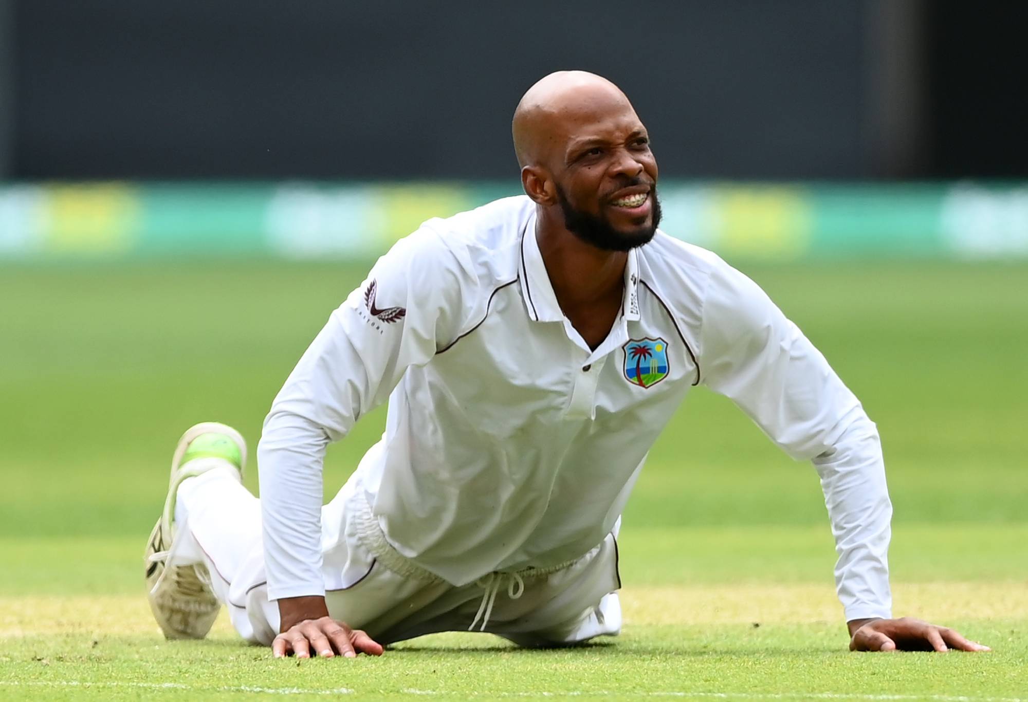PERTH, AUSTRALIA - DECEMBER 01: Roston Chase of the West Indies gets up from diving for a ball during day two of the First Test match between Australia and the West Indies at Optus Stadium on December 01, 2022 in Perth, Australia. (Photo by Quinn Rooney - CA/Cricket Australia via Getty Images)