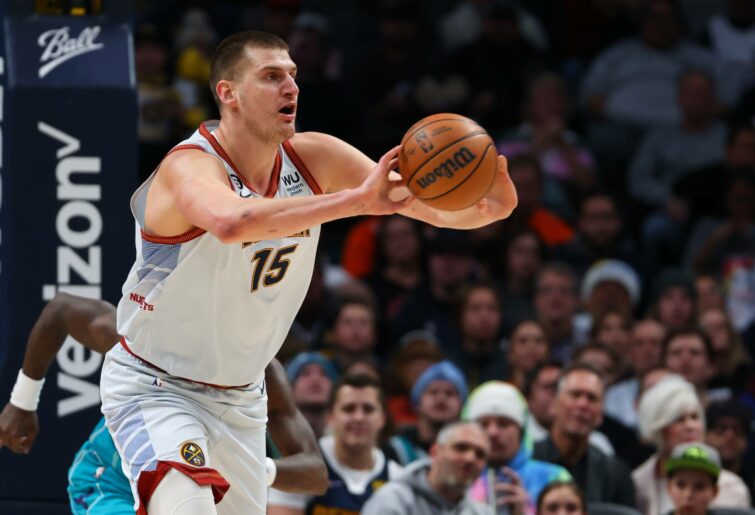 DENVER, CO - DECEMBER 18: Nikola Jokic #15 of the Denver Nuggets passes the ball against the Charlotte Hornets during the first half at Ball Arena on December 18, 2022 in Denver, Colorado. NOTE TO USER: User expressly acknowledges and agrees that, by downloading and or using this photograph, User is consenting to the terms and conditions of the Getty Images License Agreement (Photo by Justin Tafoya/Getty Images)
