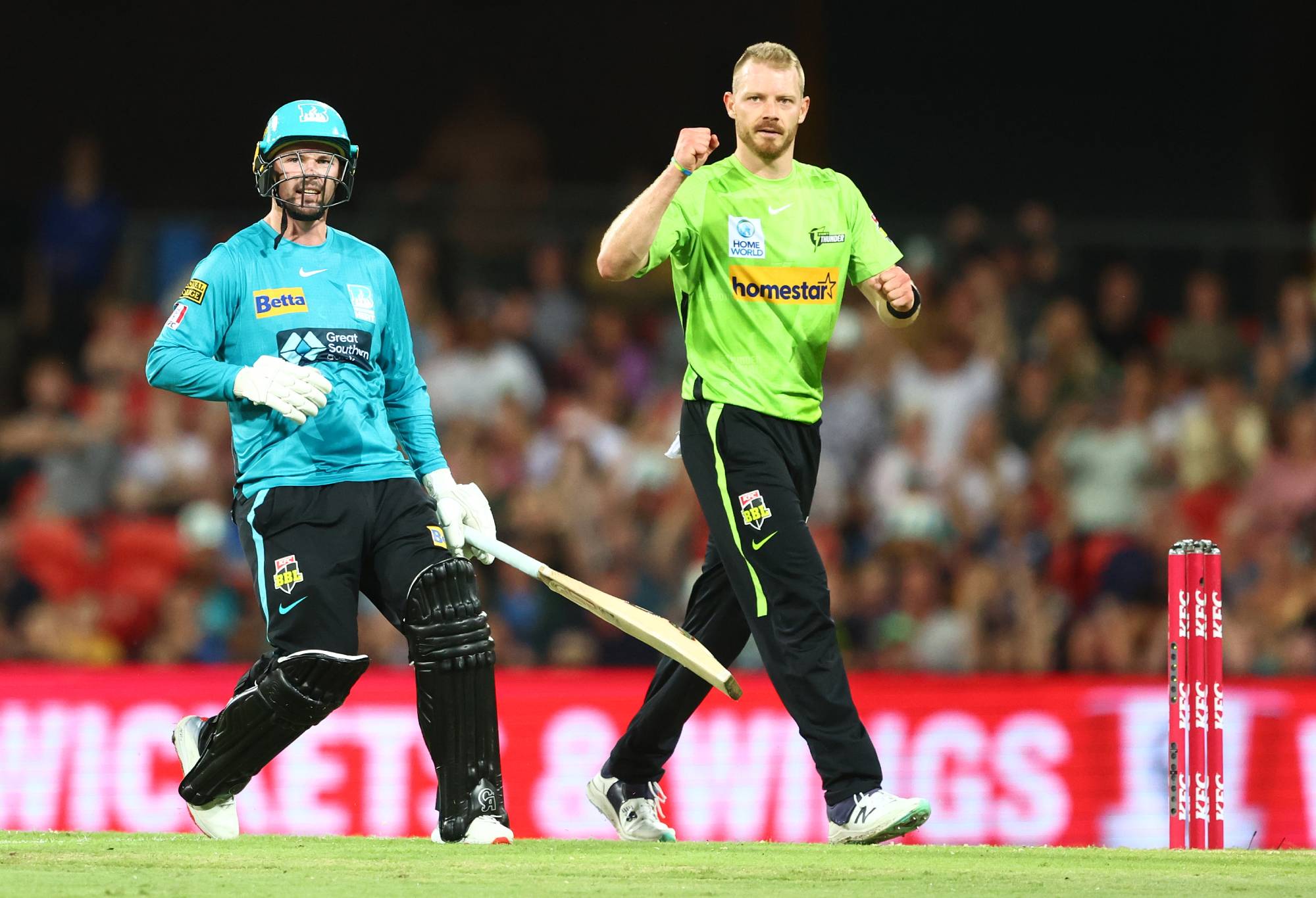 GOLD COAST, AUSTRALIA - DECEMBER 29: Nathan McAndrew of the Thunder celebrates dismissing Colin Munro of the Heat during the Men's Big Bash League match between the Brisbane Heat and the Sydney Thunder at Metricon Stadium, on December 29, 2022, in Gold Coast, Australia. (Photo by Chris Hyde/Getty Images)
