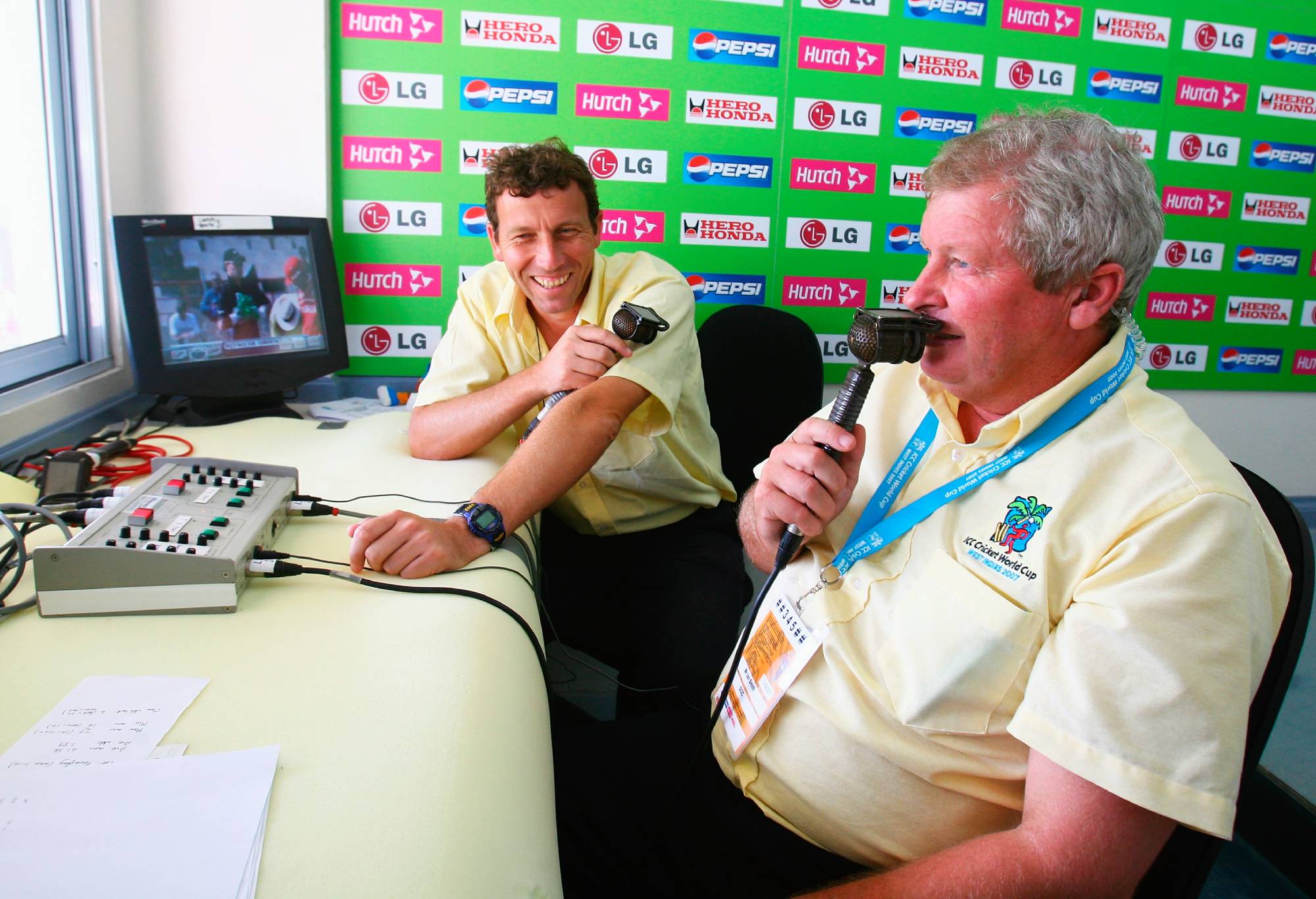 GROS ISLET, SAINT LUCIA - MARCH 22: Commentators Michael Atherton (L) and Ian Smith look on during the ICC Cricket World Cup Group C match between Canada and New Zealand at the Beausejour Cricket Ground on March 22, 2007 in Gros Islet, Saint Lucia.  (Photo by Tom Shaw/Getty Images)