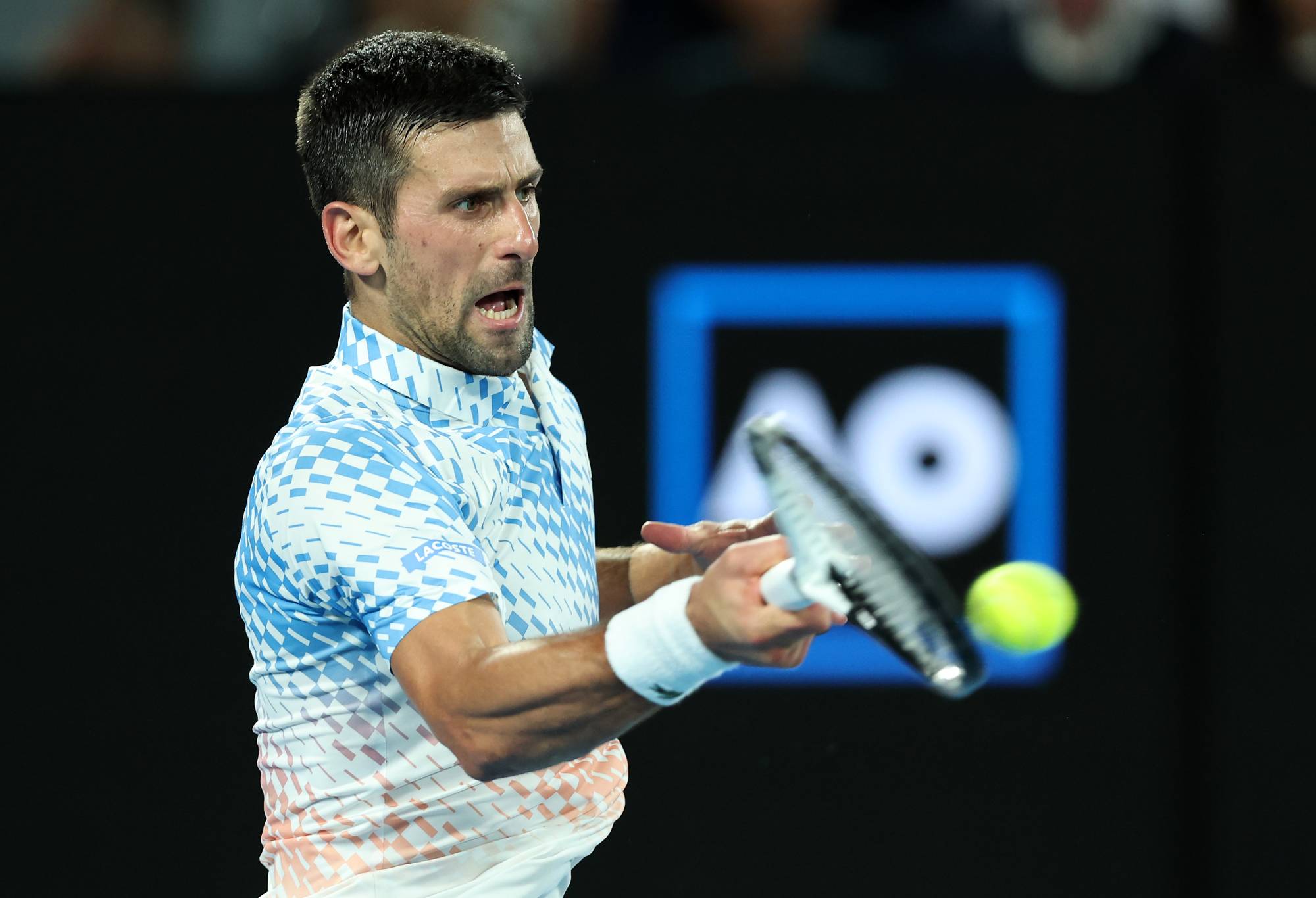 MELBOURNE, AUSTRALIA - JANUARY 29: Novak Djokovic of Serbia plays a forehand in the Mens Singles Final against Stefanos Tsitsipas of Greece during day 14 of the 2023 Australian Open at Melbourne Park on January 29, 2023 in Melbourne, Australia. (Photo by Cameron Spencer/Getty Images)