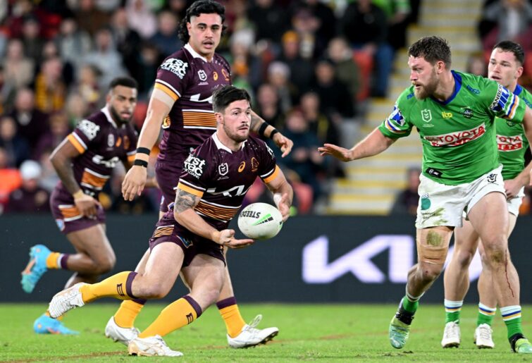 Cory Paix of the Broncos passes the ball during the round 14 NRL match between the Brisbane Broncos and the Canberra Raiders at Suncorp Stadium, on June 11, 2022, in Brisbane, Australia