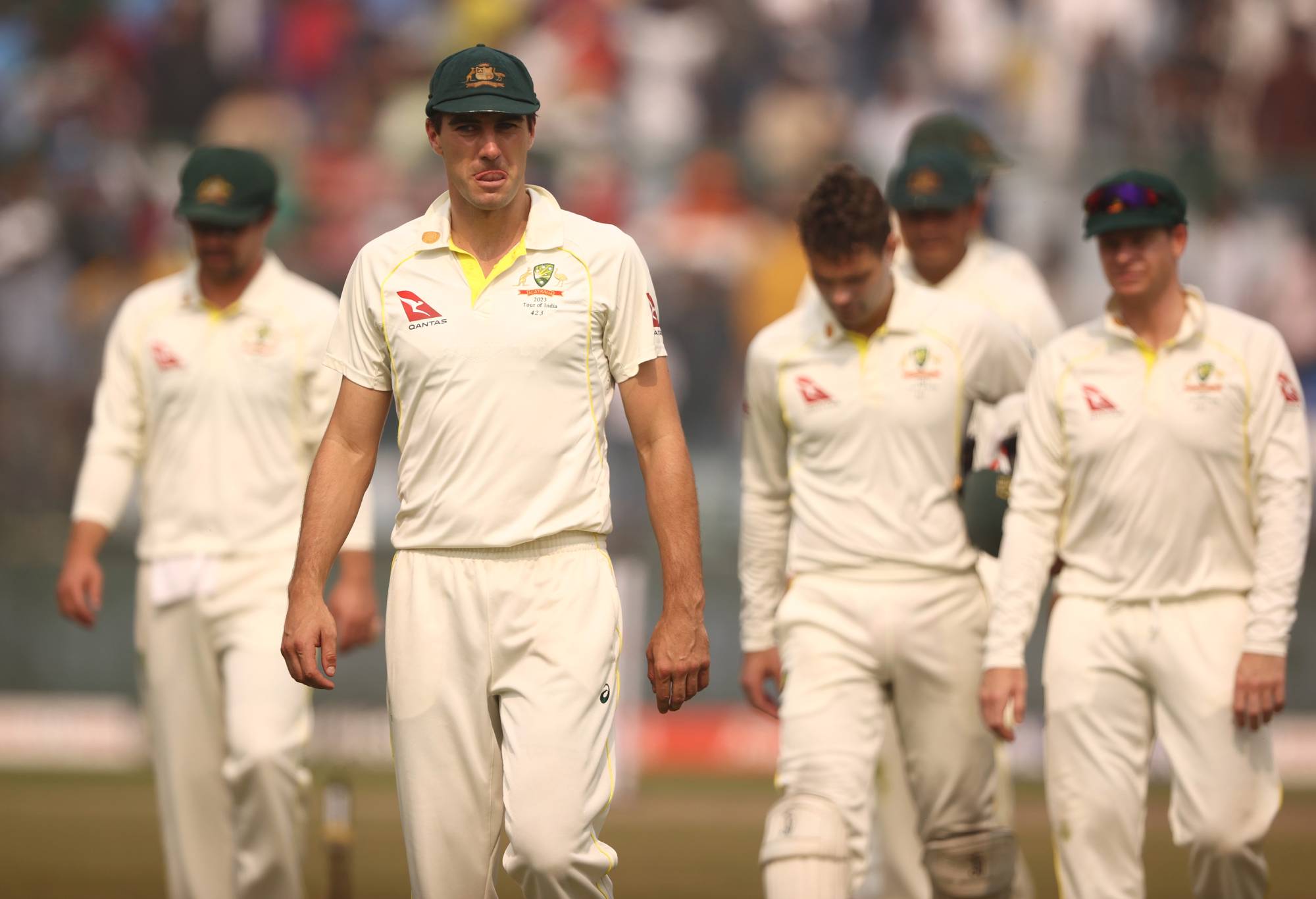 DELHI, INDIA - FEBRUARY 19: Pat Cummins of Australia leads the team off the ground after they were defeated by India during day three of the Second Test match in the series between India and Australia at Arun Jaitley Stadium on February 19, 2023 in Delhi, India. (Photo by Robert Cianflone/Getty Images)