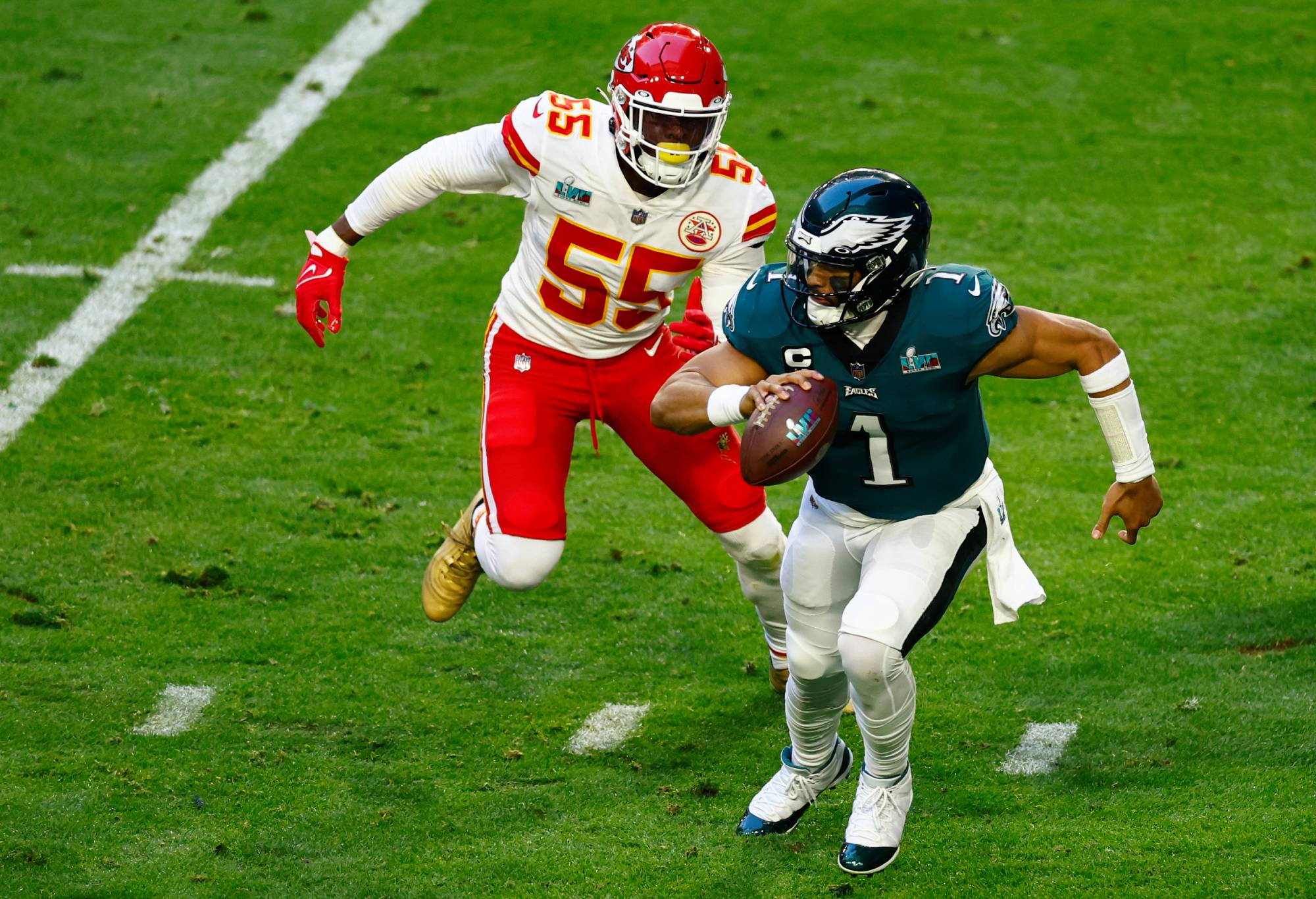 12: Jalen Hurts #1 of the Philadelphia Eagles looks to pass against the Kansas City Chiefs during the fourth quarter in Super Bowl LVII at State Farm Stadium on February 12, 2023 in Glendale, Arizona. (Photo by Gregory Shamus/Getty Images)