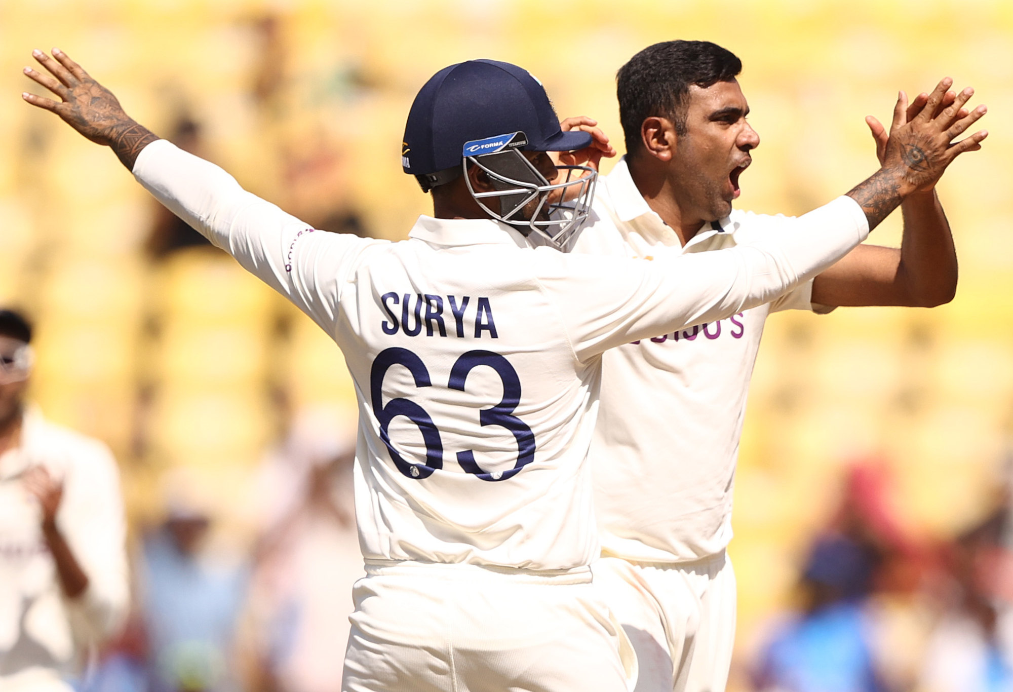 Ravichandran Ashwin celebrates taking the wicket of Matt Renshaw.