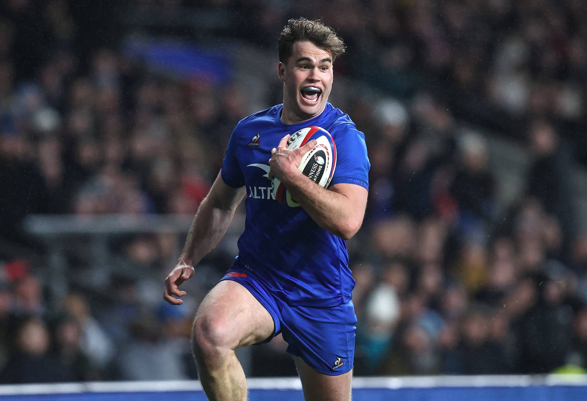 Damian Penaud of France celebrates early as he sees a clear path to score his 5th try during the Guinness Six Nations Rugby match between England and France at Twickenham Stadium on March 11, 2023 in London, United Kingdom. (Photo by Charlotte Wilson/Offside/Offside via Getty Images)