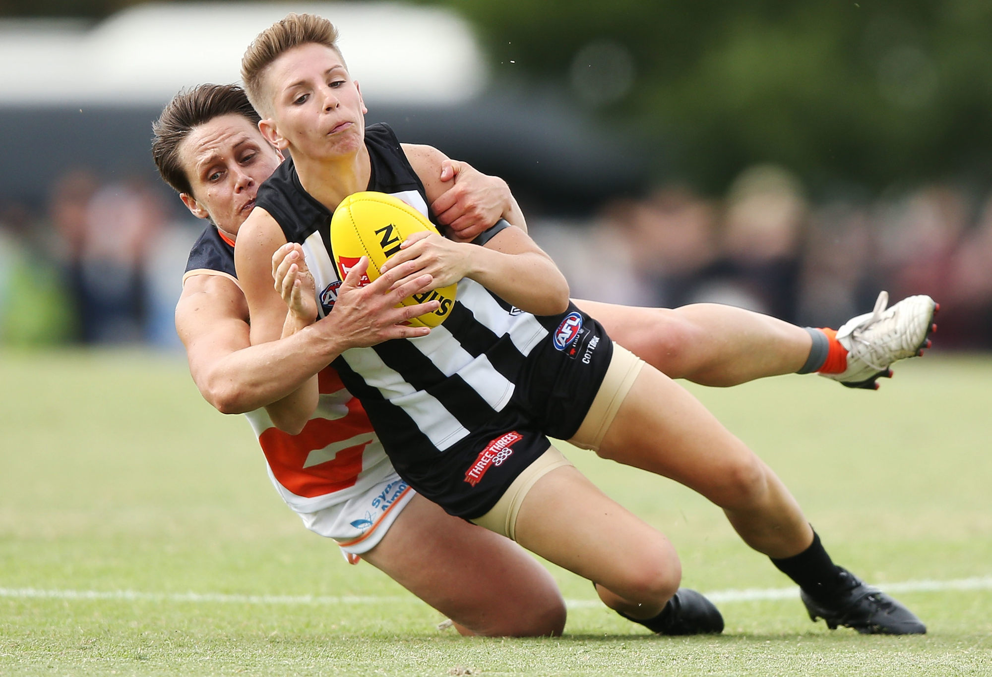 Collingwood's Emma Grant is tackled during a 2018 AFLW match.