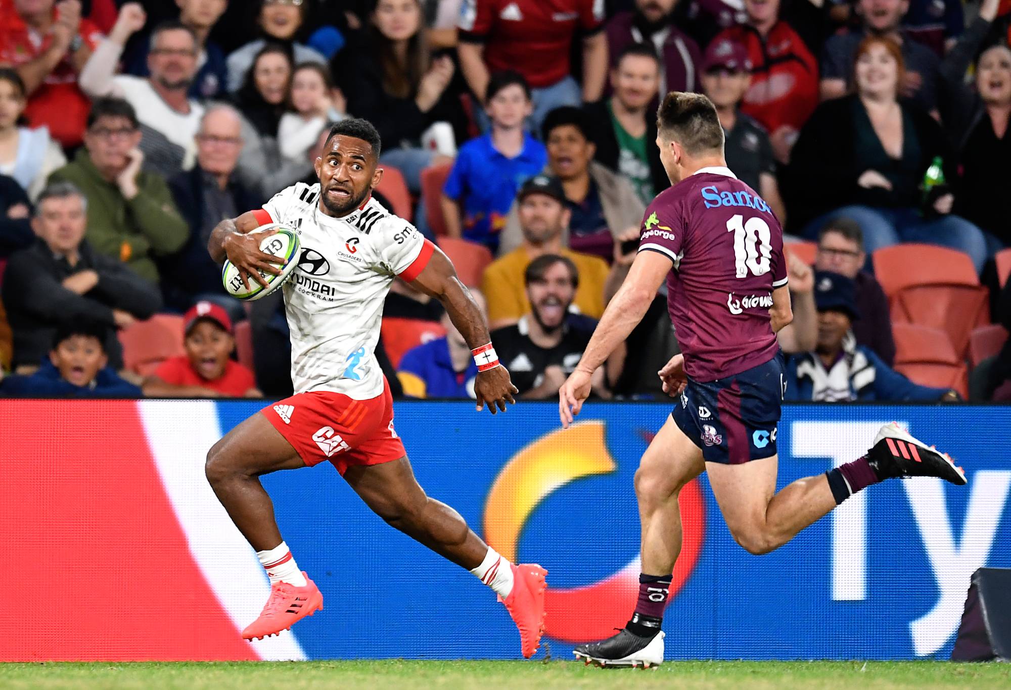 Sevu Reece of the Crusaders runs with the ball before scoring a try during the round two Super Rugby Trans-Tasman match between the Queensland Reds and the Crusaders at Suncorp Stadium on May 22, 2021 in Brisbane, Australia. (Photo by Albert Perez/Getty Images)