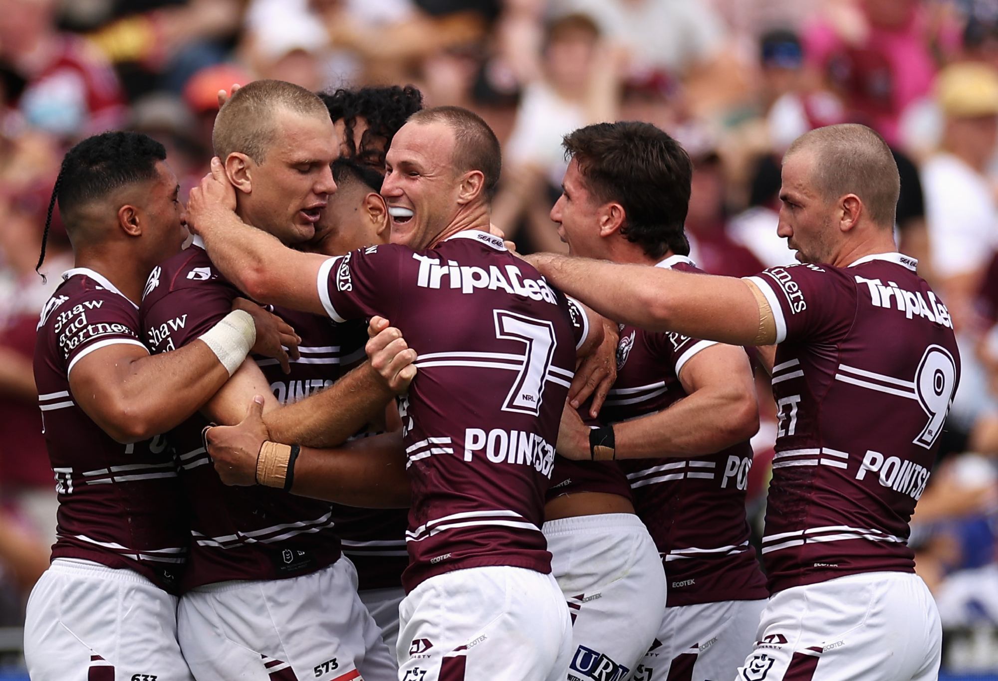 SYDNEY, AUSTRALIA - MARCH 04: Tom Trbojevic of the Sea Eagles celebrates scoring a try with team mates during the round one NRL match between the Manly Sea Eagles and the Canterbury Bulldogs at 4 Pines Park on March 04, 2023 in Sydney, Australia. (Photo by Cameron Spencer/Getty Images)