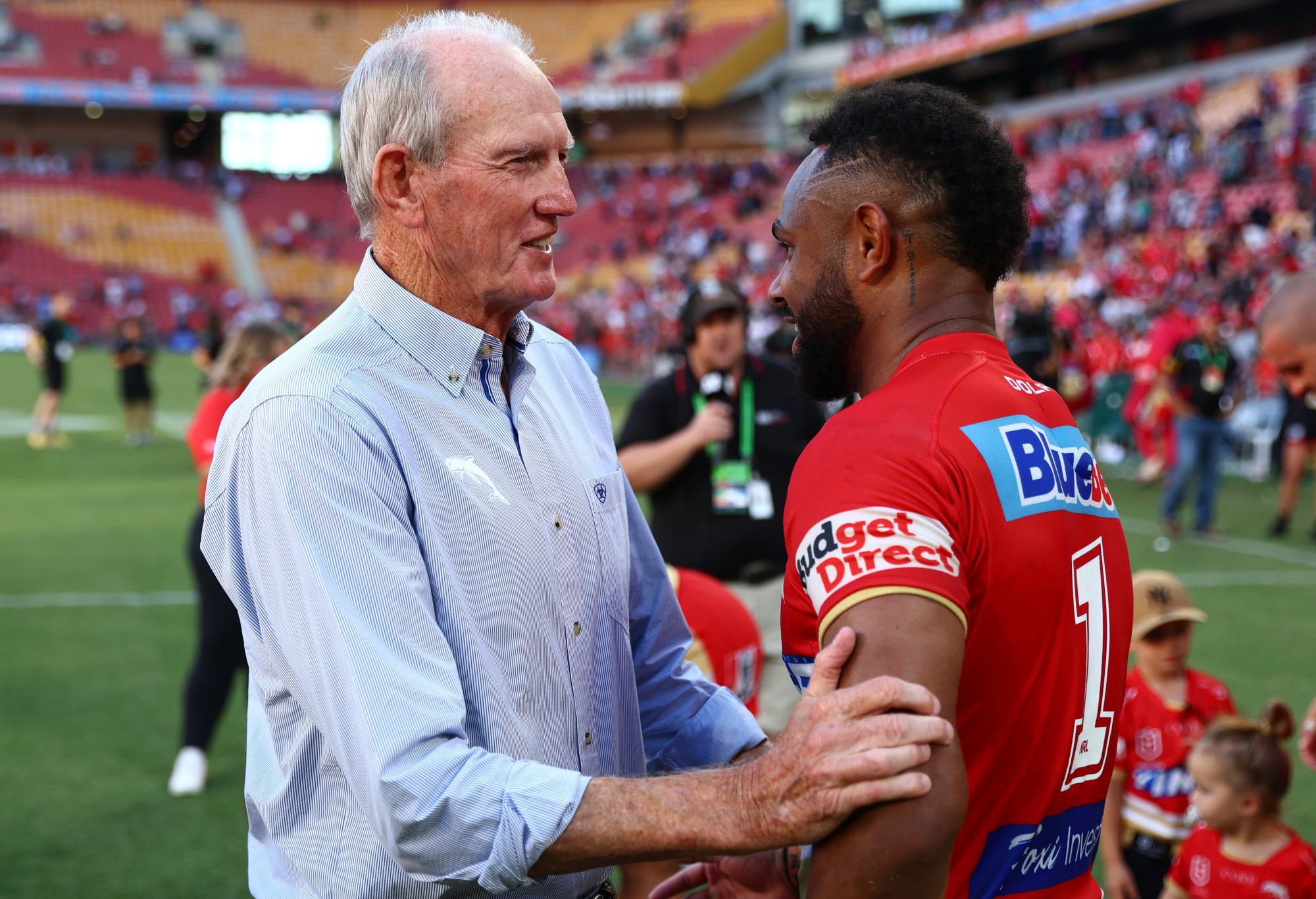 BRISBANE, AUSTRALIA - MARCH 05: Dolphins coach Wayne Bennett with players after the round one NRL match between the Dolphins and Sydney Roosters at Suncorp Stadium on March 05, 2023 in Brisbane, Australia. (Photo by Chris Hyde/Getty Images)
