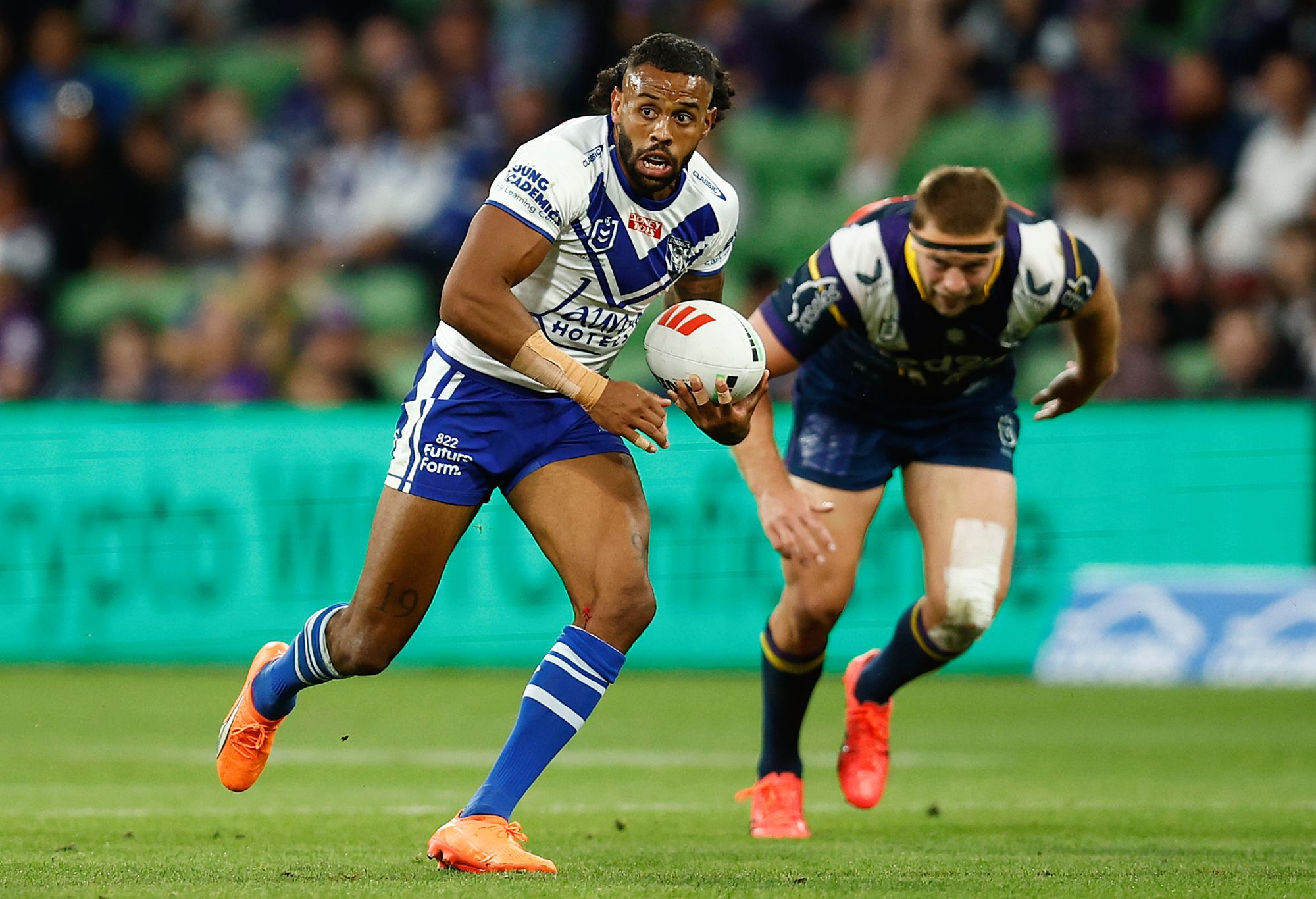 MELBOURNE, AUSTRALIA - MARCH 11: Josh Addo-Carr of the Bulldogs runs with the ball during the round two NRL match between the Melbourne Storm and Canterbury Bulldogs at AAMI Park on March 11, 2023 in Melbourne, Australia. (Photo by Daniel Pockett/Getty Images)